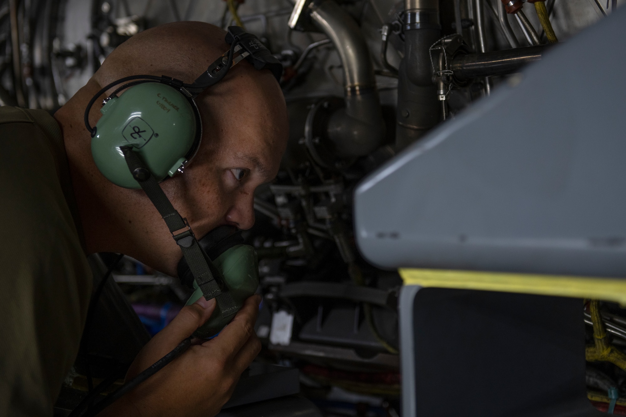 U.S. Air Force Staff Sgt. Wallace Winkler, 18th Component Maintenance Squadron test cell craftsman, inspects components of an F-15C Eagle engine inside the test cell at Kadena Air Base, Japan, Aug. 25, 2022. Airmen assigned to the engine test cell check for leaks or damage before and after tests to ensure the engine is safe to use. (U.S. Air Force photo by Senior Airman Jessi Roth)