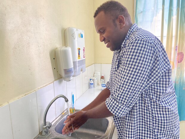 HONIARA, SOLOMON ISLANDS (Aug. 23, 2022) – Cameron Inomae, oral health therapist with Honiara City Council Dental Services, demonstrates proper handwashing techniques after participateing in a seminar on infection prevention