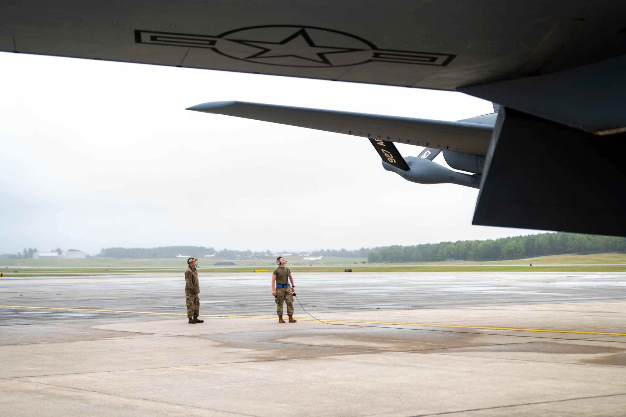 U.S. Air Force Tech Sgt. Joseph Maier and Senior Airman Kevin McFadden, 6th Aircraft Maintenance Squadron crew chiefs inspect the boom of a KC-135 Stratotanker assigned to the 91st Air Refueling Squadron before take off at Bangor Air National Guard Base, Maine, Aug. 23, 2022.