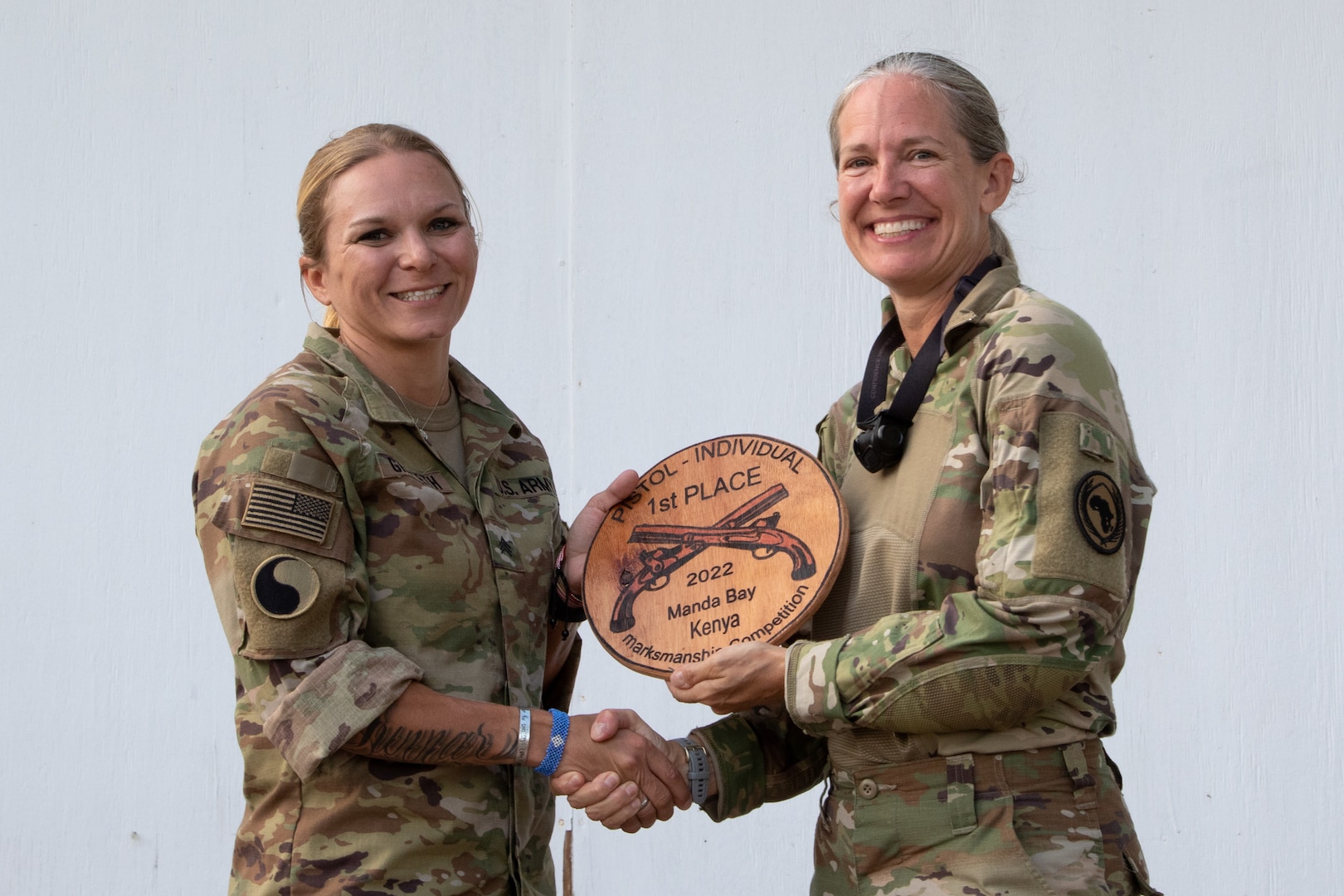 U.S. Army Sgt. Alexandra Griffeth, left, placed first in the individual pistol category in the joint-force combined arms marksmanship competition among 52 Army Guard and Air Force members assigned to Combined Joint Task Force-Horn of Africa. The competition was held July 20-25, 2022, at Camp Simba, Kenya.