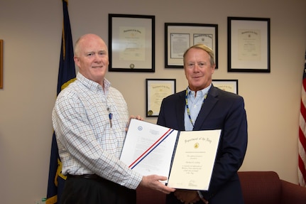 Michael Cockey, left, Deputy Director of Undersea Warfare for Naval Undersea Warfare Center (NUWC) Headquarters, was honored with a Department of the Navy Meritorious Civilian Service Award as part of a Warfare Centers Headquarters Command Awards ceremony on Aug. 22, 2022