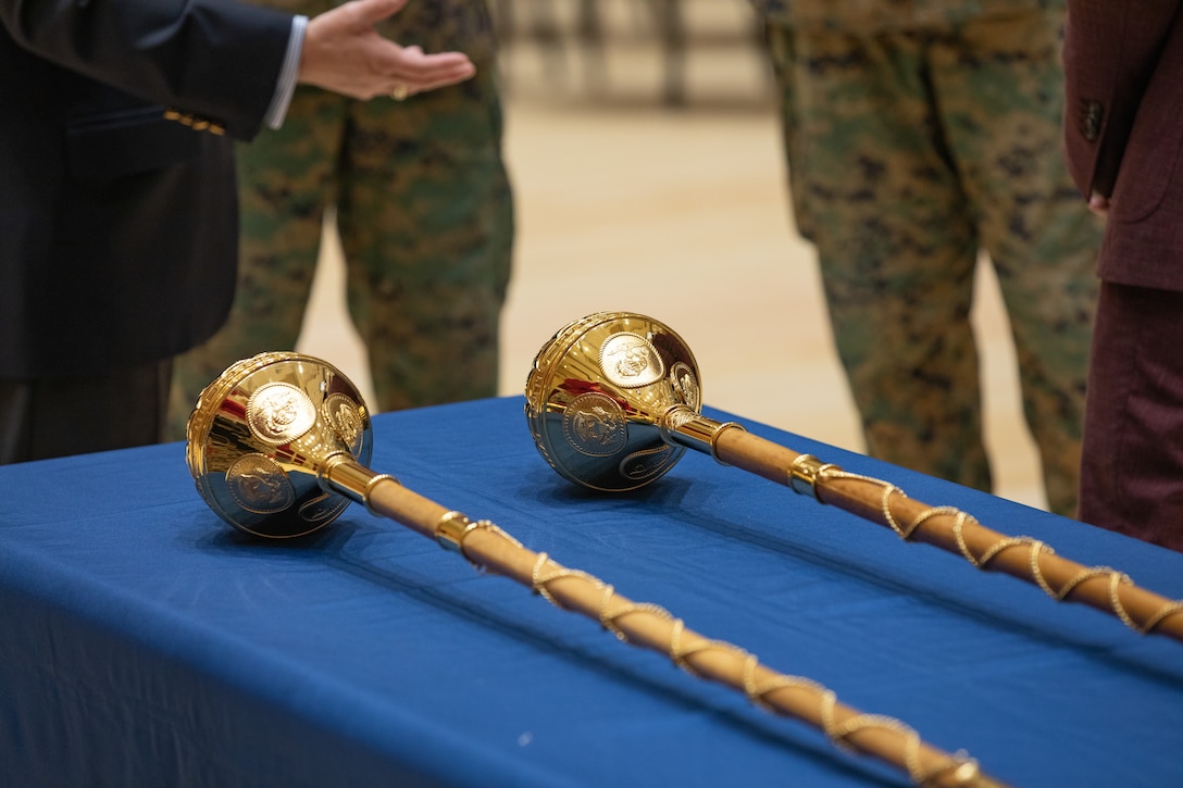 On May 16, 2022, a pair of new maces manufactured by Dalman and Narborough Regimental Mace Company were delivered from Birmingham, England, to the United States Marine Band in Washington, D.C. A small presentation ceremony was held in John Philip Sousa Band Hall at Marine Barracks Washington. Drum Major Master Gunnery Sgt. Duane King, Director Col. Jason K. Fettig and Tommy Dalman each gave remarks, and guests had the chance to examine the maces close up.