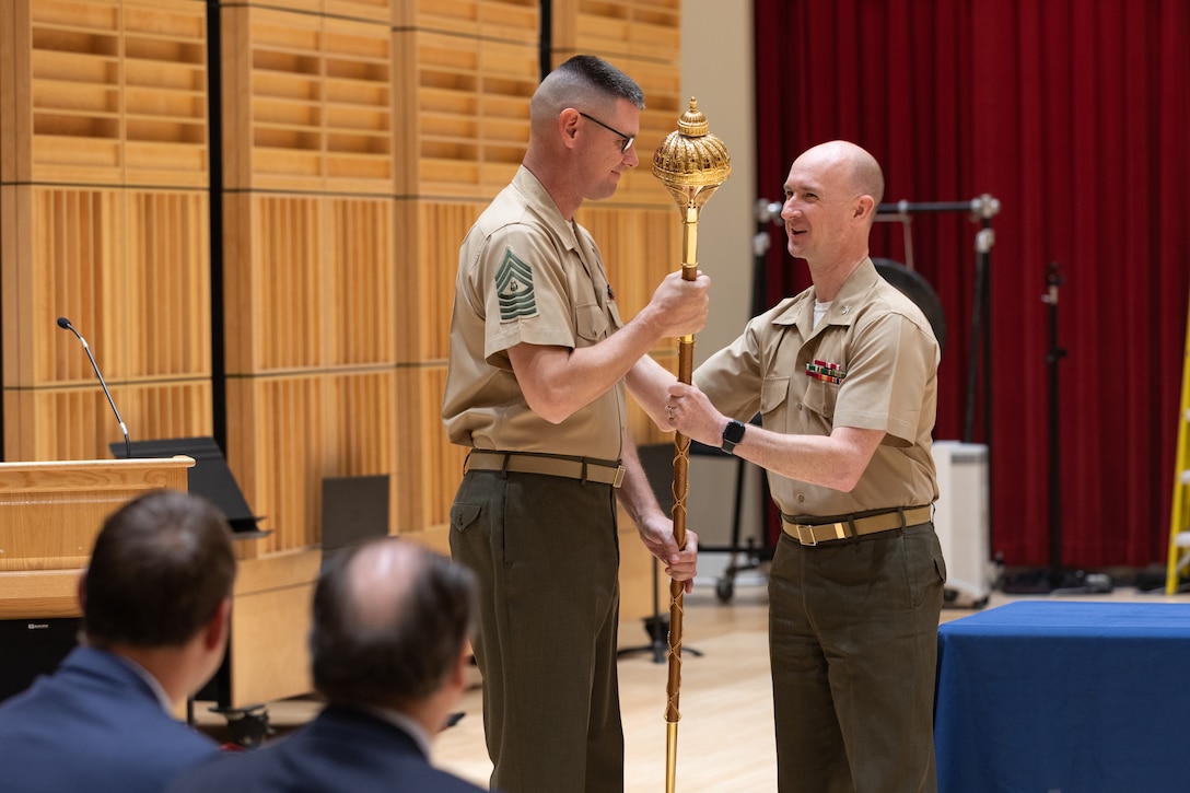 On May 16, 2022, a pair of new maces manufactured by Dalman and Narborough Regimental Mace Company were delivered from Birmingham, England, to the United States Marine Band in Washington, D.C. A small presentation ceremony was held in John Philip Sousa Band Hall at Marine Barracks Washington. Drum Major Master Gunnery Sgt. Duane King, Director Col. Jason K. Fettig and Tommy Dalman each gave remarks, and guests had the chance to examine the maces close up.