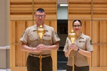 On May 16, 2022, a pair of new maces were delivered to the United States Marine Band for use by the Drum Major and Assistant Drum Major. Pictured, Drum Major Master Gunnery Sgt. Duane King and Assistant Drum Major Gunnery Sgt. Monica Preston pose with the new maces.