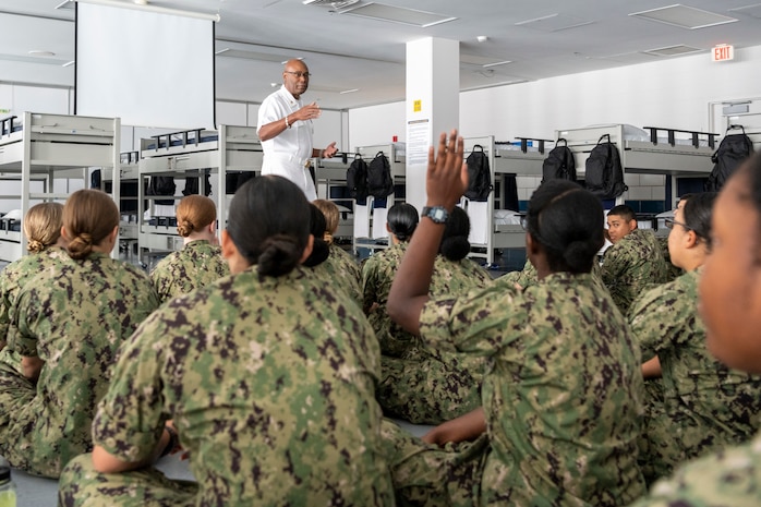 Command Master Chief Curtis Blunt, command master chief, III Marine Expeditionary Force, speaks to recruits inside a compartment of the USS John F. Kennedy recruit barracks during his visit to Recruit Training Command. III MEF, headquartered in Okinawa, Japan, is sponsoring a recruit division, Division 263, for the first time in its history. More than 40,000 recruits train annually at the Navy's only boot camp.