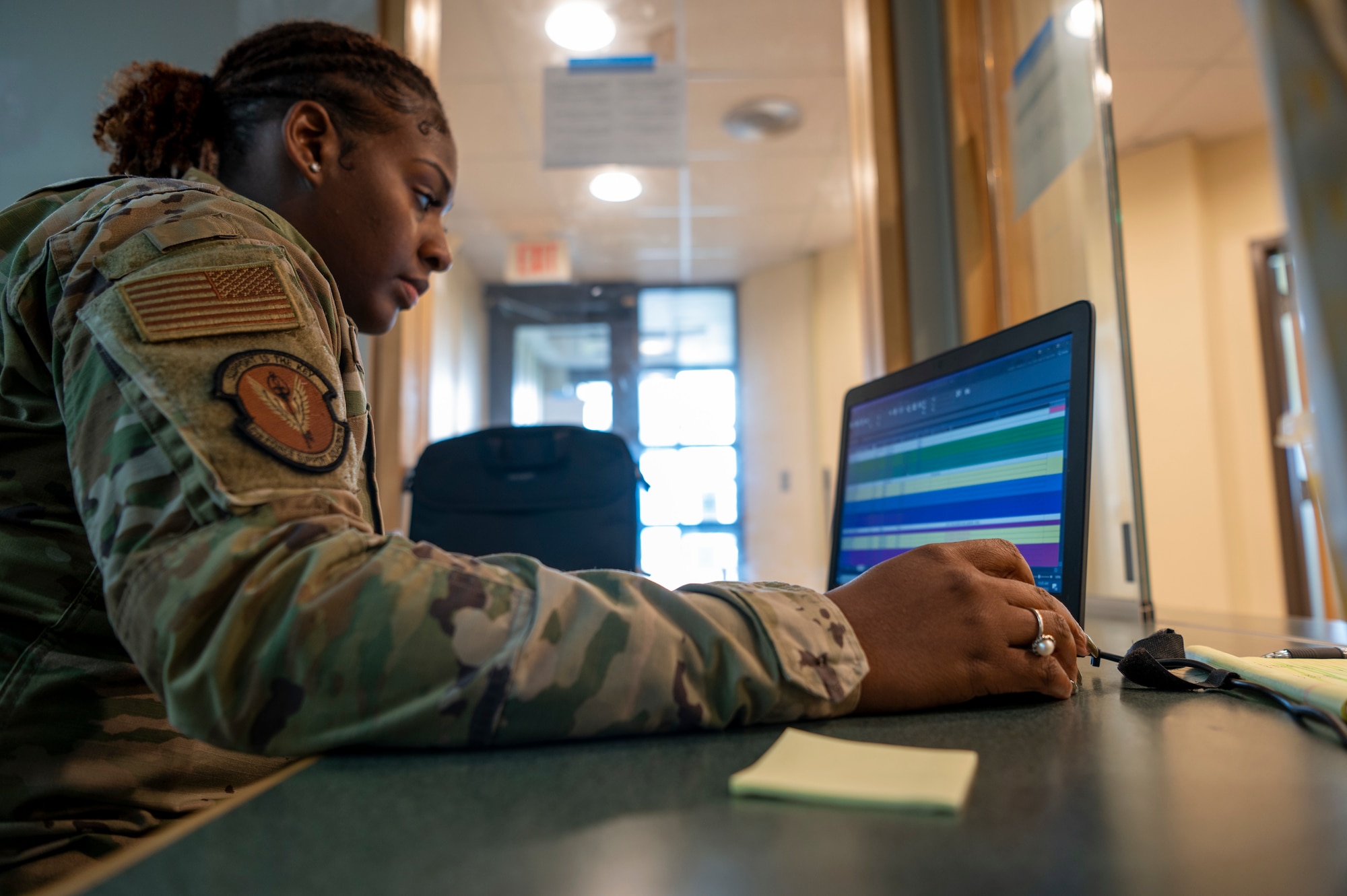 U.S. Air Force Senior Airman Makaila Harvey, 6th Force Support Squadron customer support technician, works on her computer at Bangor Air National Guard Base, Maine, Aug. 25, 2022.