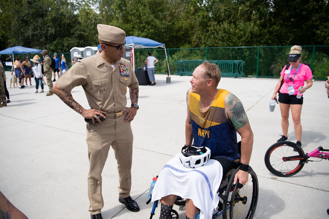 CENTCOM’s Senior Enlisted Leader, Fleet Master Chief Derrick "Wally" Walters, talks to a team Navy athlete during the 2022 Department of Defense Warrior Games at the ESPN Wide World of Sports Complex in Orlando, Florida, Aug. 25, 2022. At the games, service members and veterans from across the DoD compete in adaptive sports alongside armed forces competitors from Canada and Ukraine. (Photo by U.S. Marine Corps Gunnery Sgt. Eric L. Alabiso II)