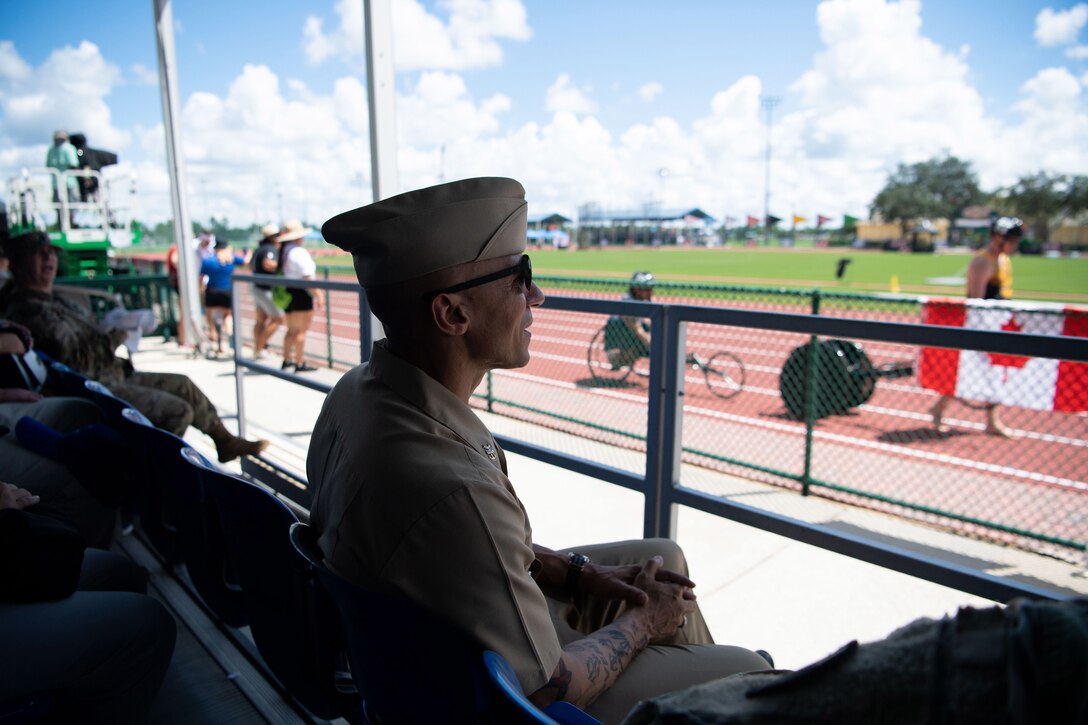 CENTCOM’s Senior Enlisted Leader, Fleet Master Chief Derrick "Wally" Walters, watches track and field competition during the 2022 Department of Defense Warrior Games at the ESPN Wide World of Sports Complex in Orlando, Florida, Aug. 25, 2022. At the games, service members and veterans from across the DoD compete in adaptive sports alongside armed forces competitors from Canada and Ukraine. (Photo by U.S. Marine Corps Gunnery Sgt. Eric L. Alabiso II)