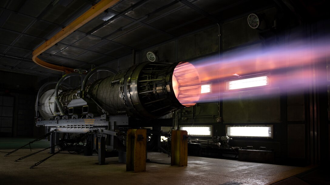 An F-15C Eagle engine runs at full afterburner inside the test cell at Kadena Air Base, Japan, Aug. 25, 2022. The test cell is a sound-suppressed facility, allowing maintainers to run the engines at in-flight performance levels, looking for any complications or failures that may arise. (U.S. Air Force photo by Senior Airman Jessi Roth)