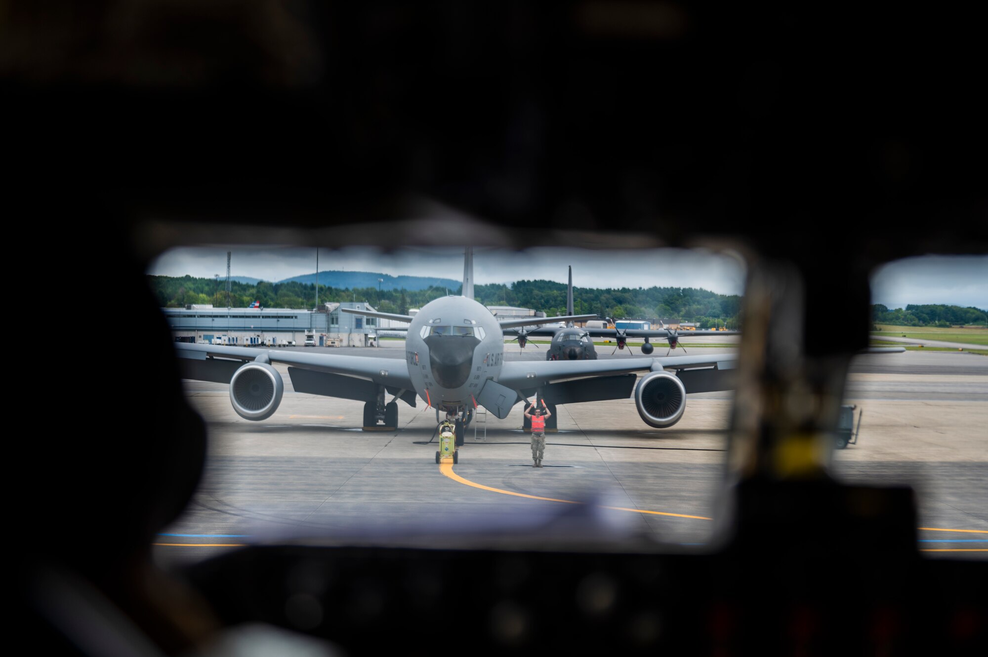 A maintenance Airmen assigned to the 6th Aircraft Maintenance Squadron marshals a KC-135 Stratotanker assigned to the 91st Air Refueling Squadron before taking-off at Bangor Air National Guard Base, Maine, Aug. 24, 2022.