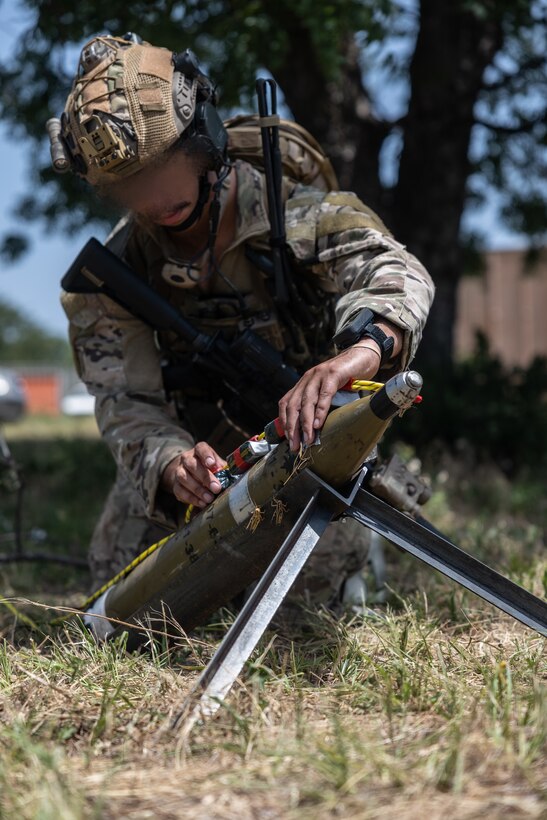 An explosive ordnance disposal technician with Marine Forces Special Operations Command prepares to safely reduce an improvised explosive device during a training event June 17, 2022. The EOD primer tests all aspects of a technician’s knowledge and expertise needed to perform as the only tech on a Marine Special Operations Team while operating in austere, politically sensitive, or hostile environments. EOD technicians assigned to MARSOC have completed Marine Special Operations Forces Explosive Ordnance Disposal Level 1, which trains Fleet Marine Force EOD technicians in the knowledge and skills required to support the core tasks assigned to MARSOC as a special operations capability specialist. (U.S. Marine Corps photo by Sgt. Brennan Priest)