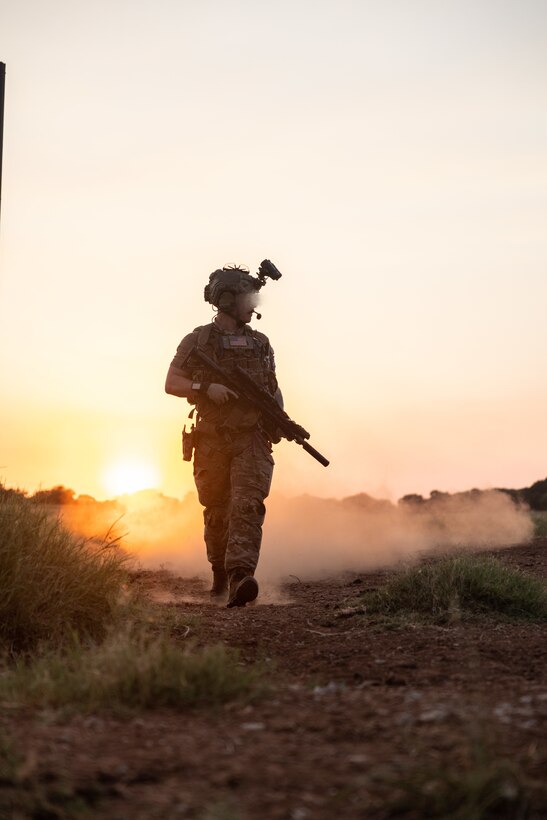 A critical skills operator patrols alongside explosive ordnance disposal technicians with Marine Forces Special Operations Command and Air Force Special Operations Command during a training event June 24, 2022. The EOD primer tests all aspects of a technician’s knowledge and expertise needed to perform as the only tech on a Marine Special Operations Team while operating in austere, politically sensitive, or hostile environments. EOD technicians assigned to MARSOC have completed Marine Special Operations Forces Explosive Ordnance Disposal Level 1, which trains Fleet Marine Force EOD technicians in the knowledge and skills required to support the core tasks assigned to MARSOC as a special operations capability specialist. (U.S. Marine Corps photo by Sgt. Brennan Priest)