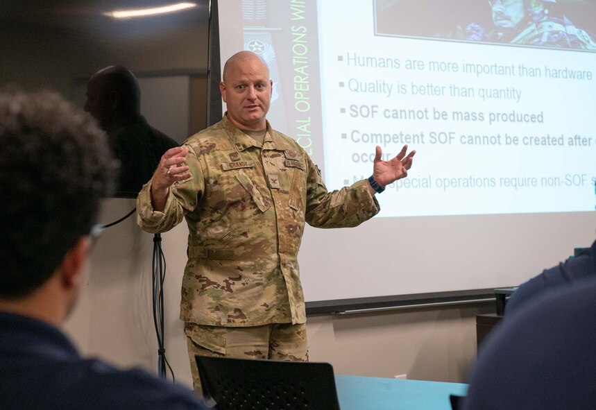 Commander speaks to civic leaders in a meeting for a mission briefing overview of the 919th SOW.