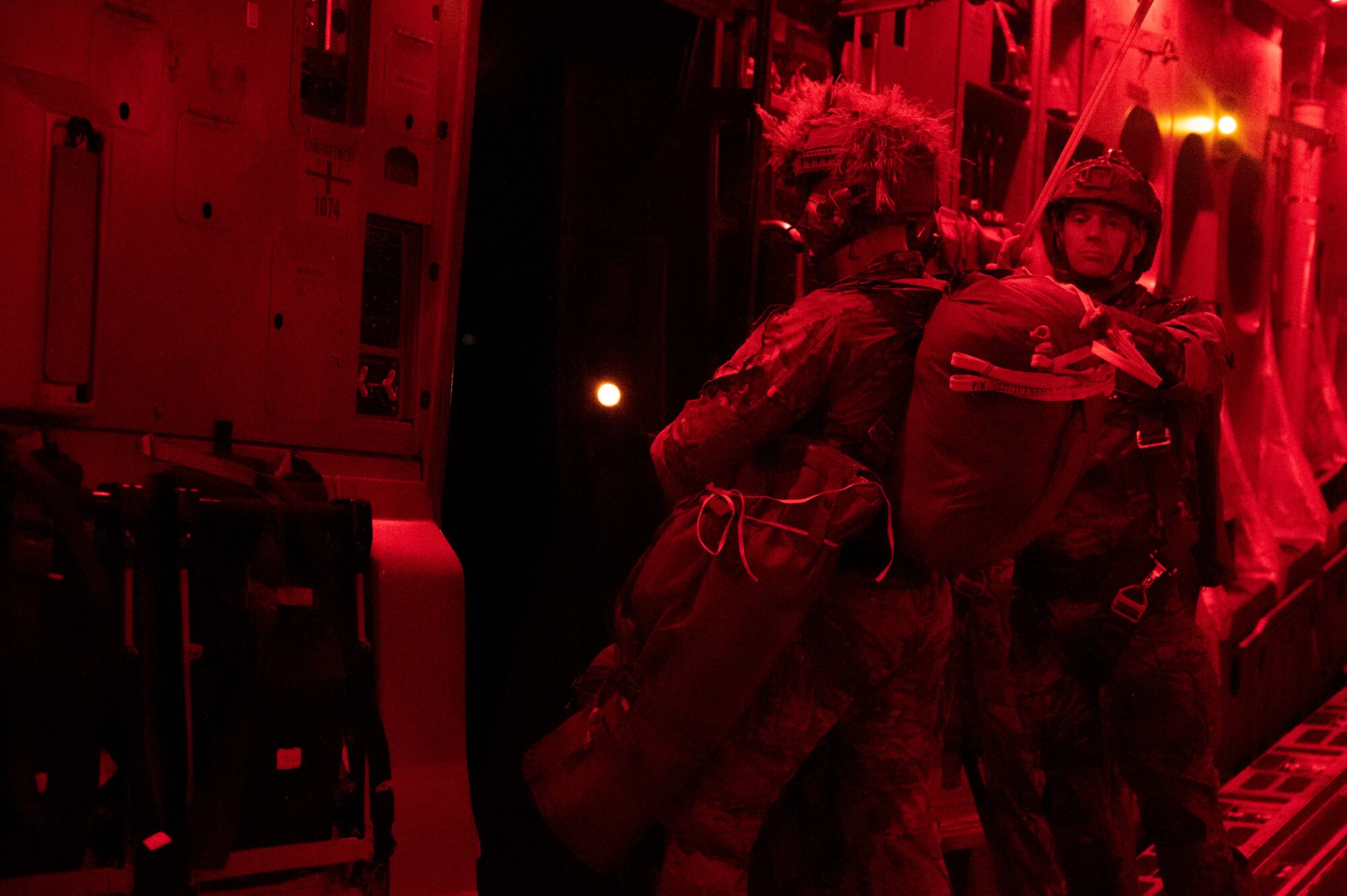 Army ranger prepares to jump out of a C-17.