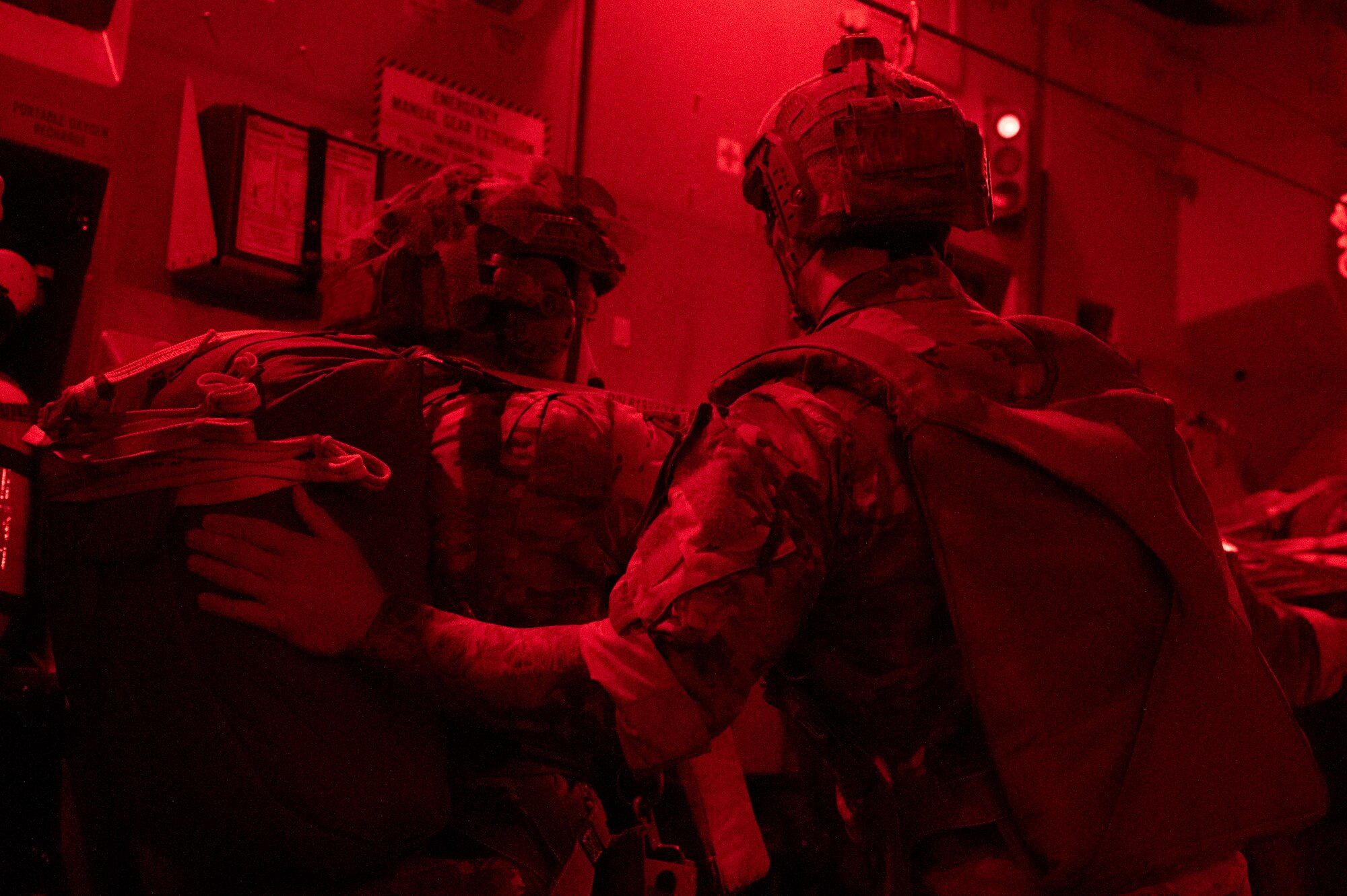 Army rangers prepare to jump out of a C-17.