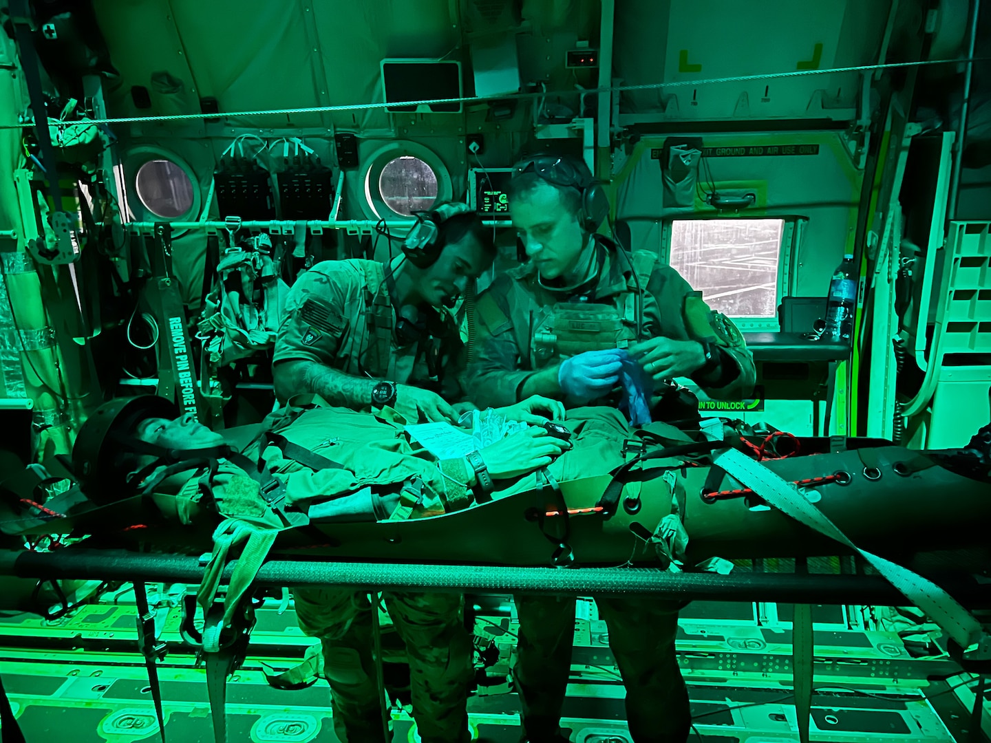 Senior Airman Matt Pluhoeski, right, a pararescue Airman assigned to the 103rd Rescue Squadron of the New York Air National Guard’s 106th Rescue Squadron, works with a Brazilian counterpart on a simulated casualty on board one of the wing’s HC-130 Combat King II search and rescue aircraft during a medical evacuation mission as part of Exercise Tapio in Campo Grande, Brazil, Aug. 24, 2022. The New York Air National Guard sent 100 personnel to participate in the exercise as part of the New York National Guard State Partnership Program relationship with Brazil.
