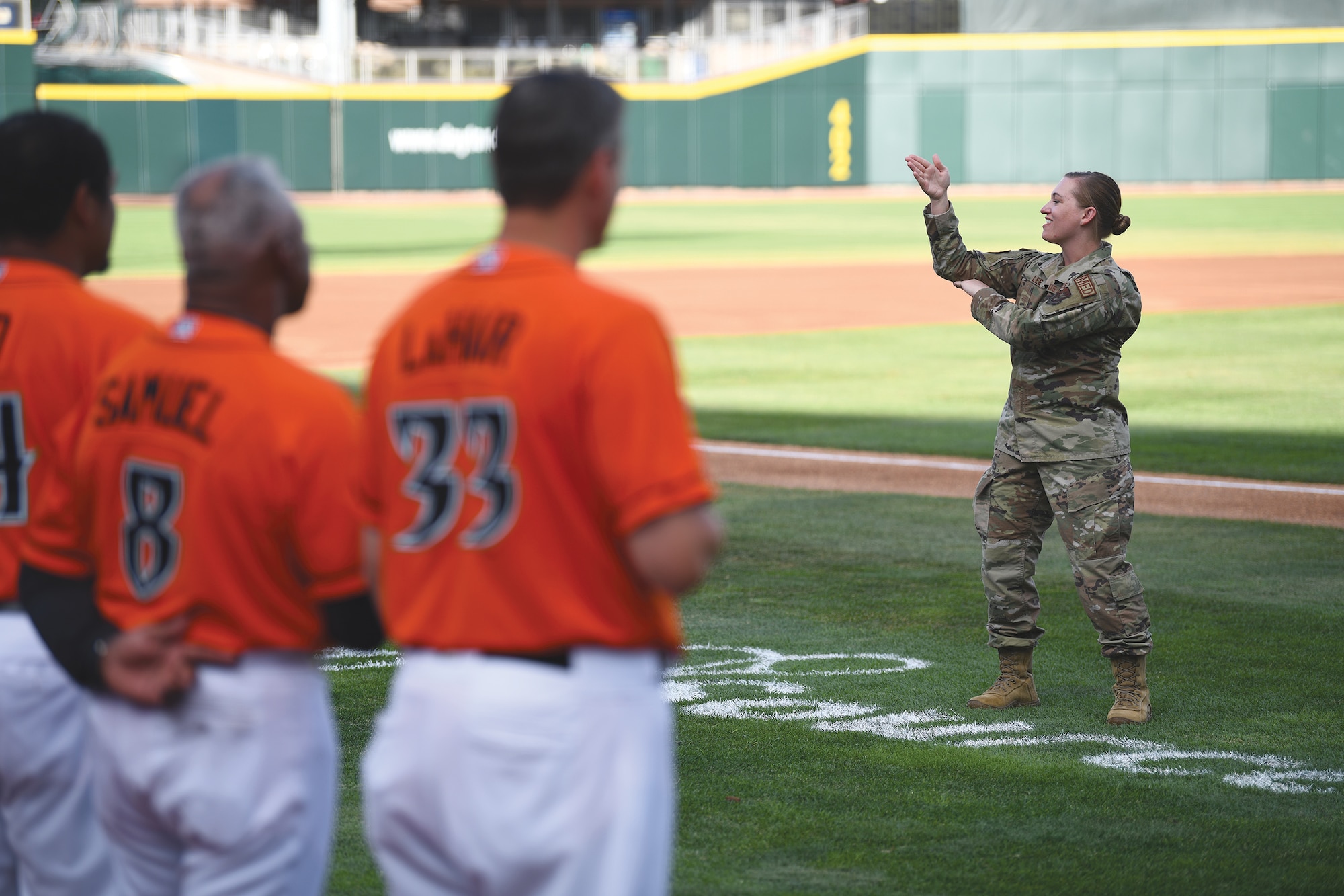 Master Sgt. Michelle Lee, 445th Aeromedical Staging Squadron medical technician, provides American Sign Language interpretation during the national anthem at a Dayton Dragons baseball game, August 5, 2022 in Dayton, Ohio.
