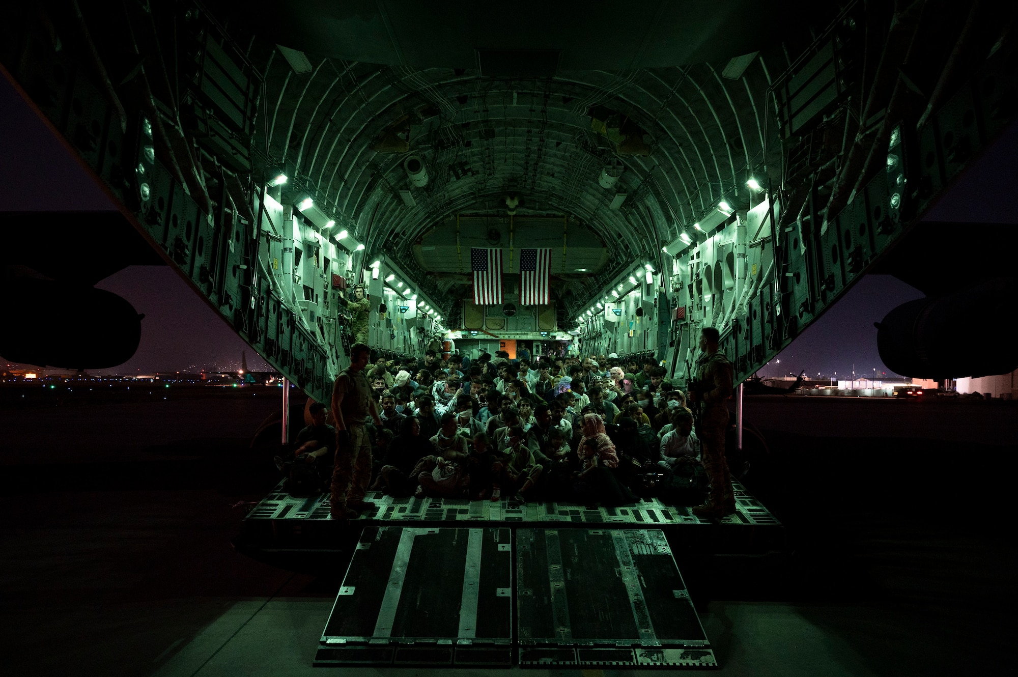 A photo of Afghan evacuees on board a C-17.