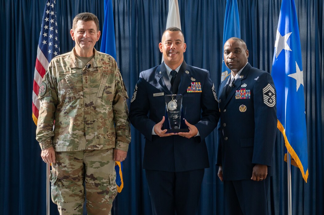 U.S. Air Force Senior Master Sgt. Jonathan Sotomayor, center, of the 125th Fighter Squadron, Florida National Guard, poses for a photo with Lt. Gen. Michael A. Loh, left, director, Air National Guard (ANG), and Chief Master Sgt. Maurice L. Williams, right, command chief, ANG, during the Outstanding Airmen of the Year ceremony at Joint Base Andrews, Maryland, on Aug. 25, 2022.