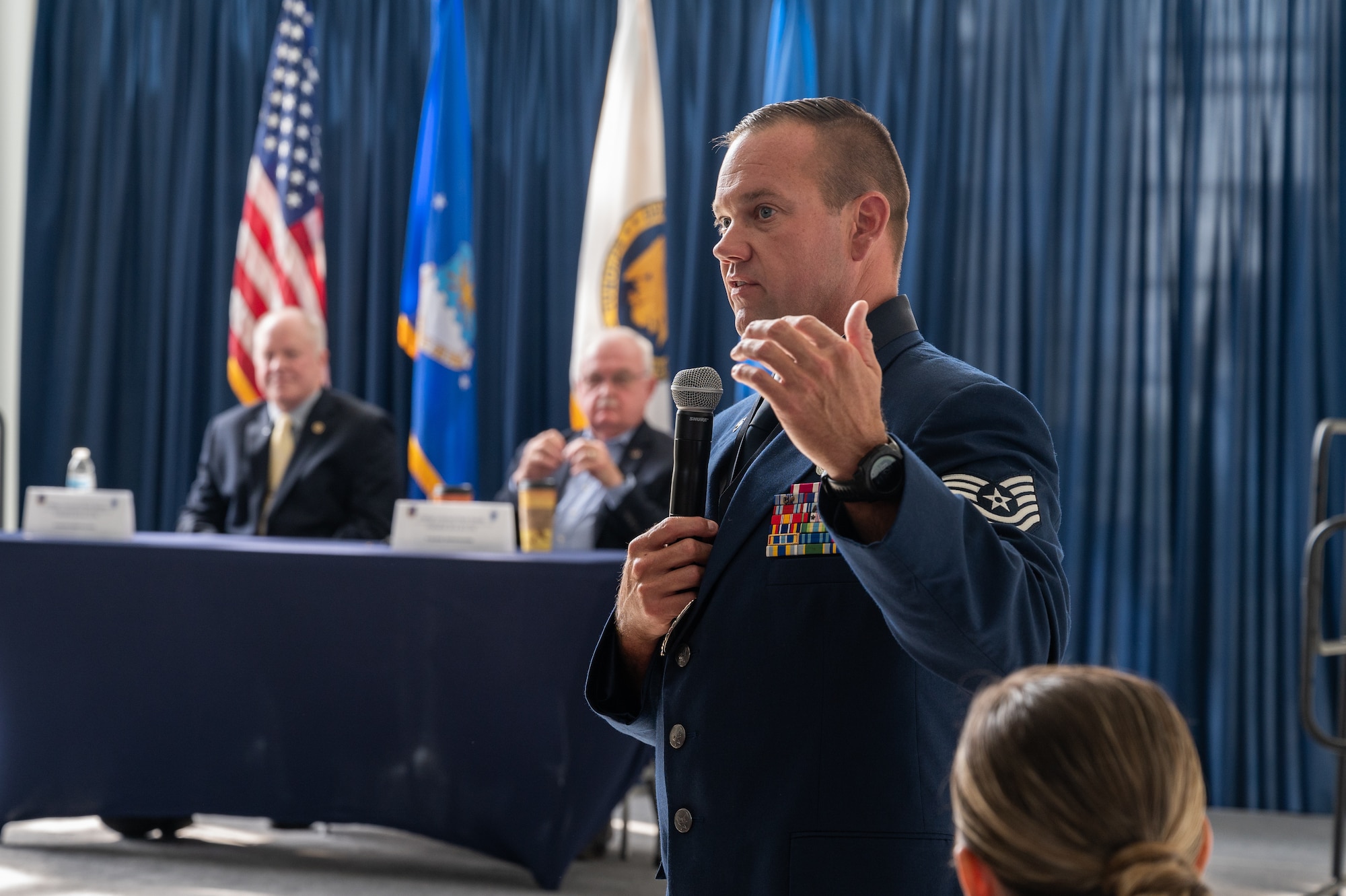U.S. Air Force Tech Sgt. Brett A. Yoakum, of the 164th Airlift Wing, Tennessee National Guard, answers a question from the crowd during a panel of former Air National Guard (ANG) senior enlisted leaders after the Outstanding Airmen of the Year ceremony at Joint Base Andrews, Maryland, on Aug. 25, 2022.