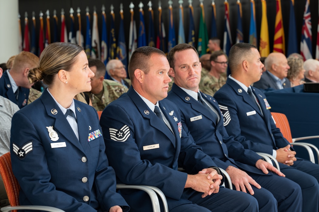 From left: U.S. Air Force Senior Airman Kristina L. Schneider, of the 179th Airlift Wing, Ohio National Guard; Tech Sgt. Brett A. Yoakum, of the 164th Airlift Wing, Tennessee National Guard; Master Sgt. Daniel P. Keller, of the 124th Fighter Wing, Idaho National Guard; and Senior Master Sgt. Jonathan Sotomayor, of the 125th Fighter Squadron, Florida National Guard; listen to remarks by Lt. Gen. Michael A. Loh, director, Air National Guard (ANG), and Chief Master Sgt. Maurice L. Williams, command chief, ANG, during the Outstanding Airmen of the Year ceremony at Joint Base Andrews, Maryland, on Aug. 25, 2022.