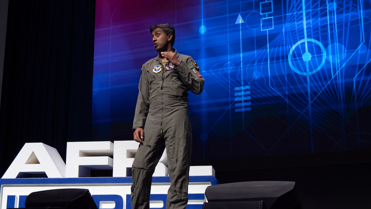 Maj. Michael Nayak, a planetary scientist and Defense Advanced Research Projects Agency program manager; formerly with the Air Force Research Laboratory’s Directed Energy Directorate, presents his talk titled, “Around the World in 80 Steps,” during AFRL Inspire. AFRL hosted this special TEDx-style event at the Air Force Institute of Technology's Kenney Hall at Wright-Patterson Air Force Base, Aug. 23, 2022. (U.S. Air Force photo / Keith Lewis)
