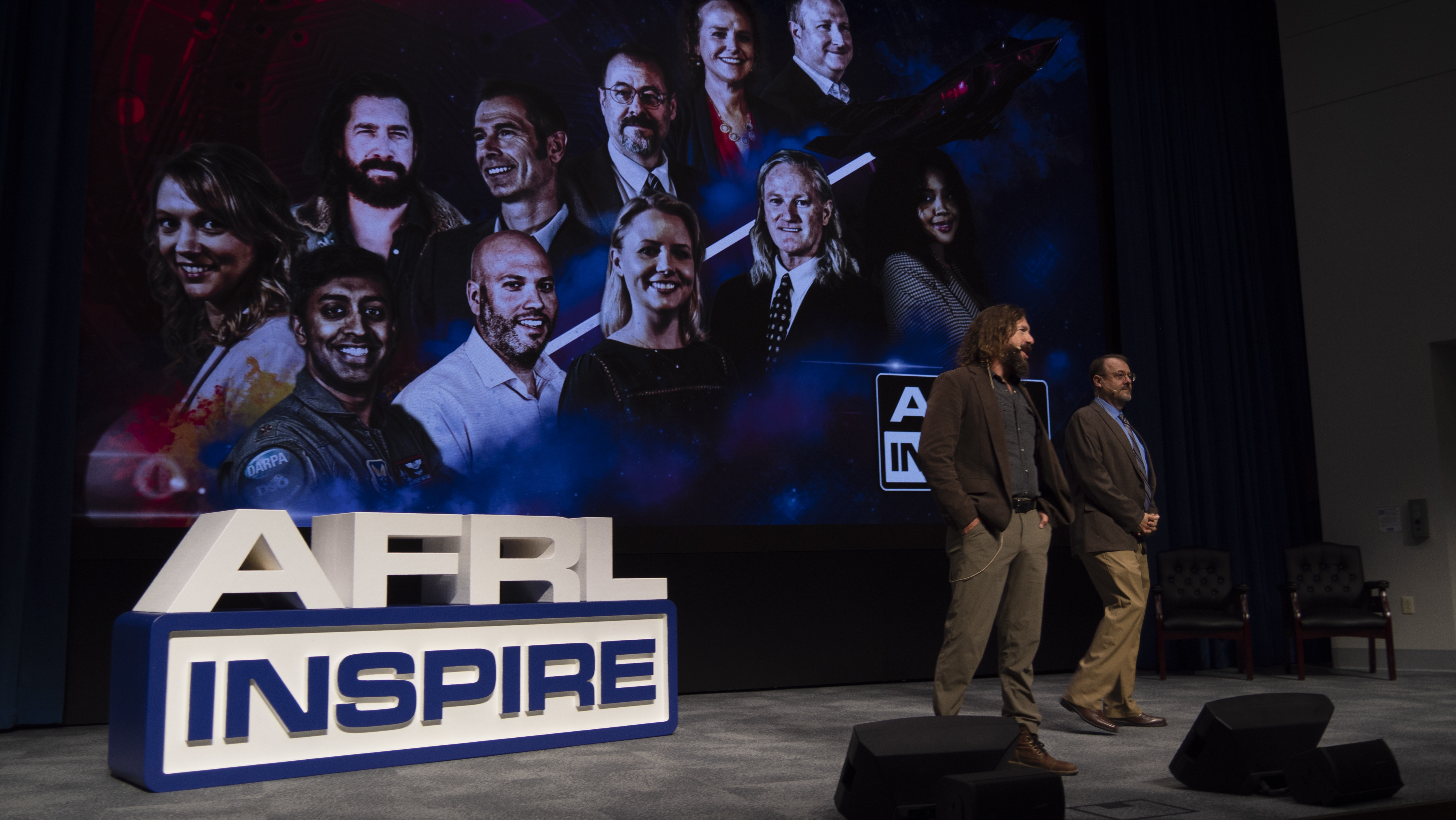 Air Force Research Laboratory historians Jeff Duford, left, and Dr. Darren Raspa, right, host AFRL Inspire in celebration of the U.S. Air Force's 75th anniversary. AFRL held this special TEDx-style event at the Air Force Institute of Technology's Kenney Hall at Wright-Patterson Air Force Base, Aug. 23, 2022. (U.S. Air Force photo / Keith Lewis)