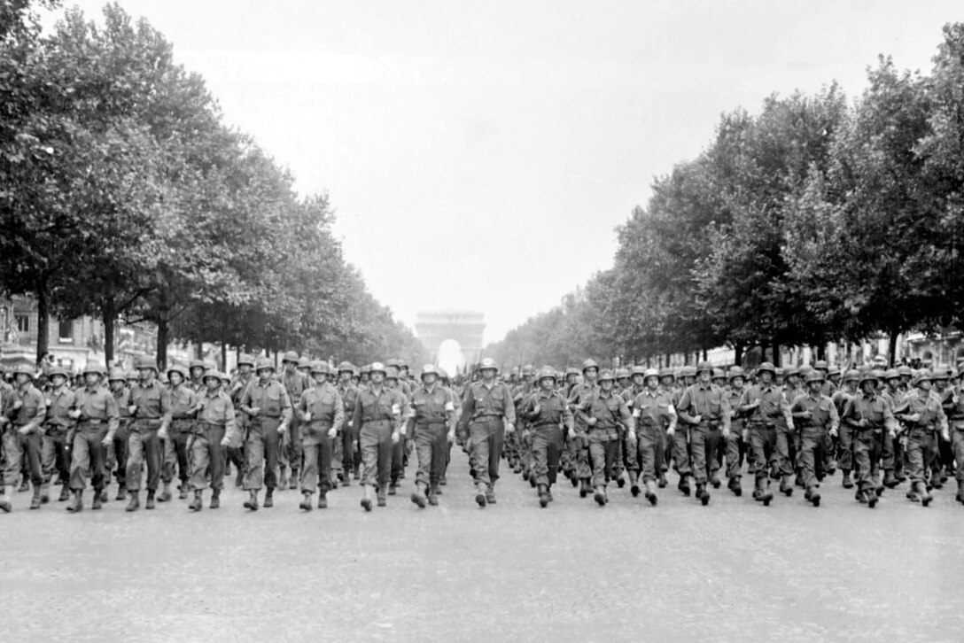 Soldiers from the 28th Division march down the Champs-Elysées in Paris during a "victory parade" on Aug. 29, 1944, during World War II.