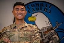 U.S. Air Force Airman 1st Class Jacob Cabanero, 1st Combat Camera Squadron public affairs specialist, poses for a photo in the squadron’s heritage room on Joint Base Charleston, South Carolina, August 19, 2022. Combat Camera acquires still and motion imagery in support of classified and unclassified air, sea, and ground military operations. (U.S. Air Force photo by Airman 1st Class Christian Silvera)