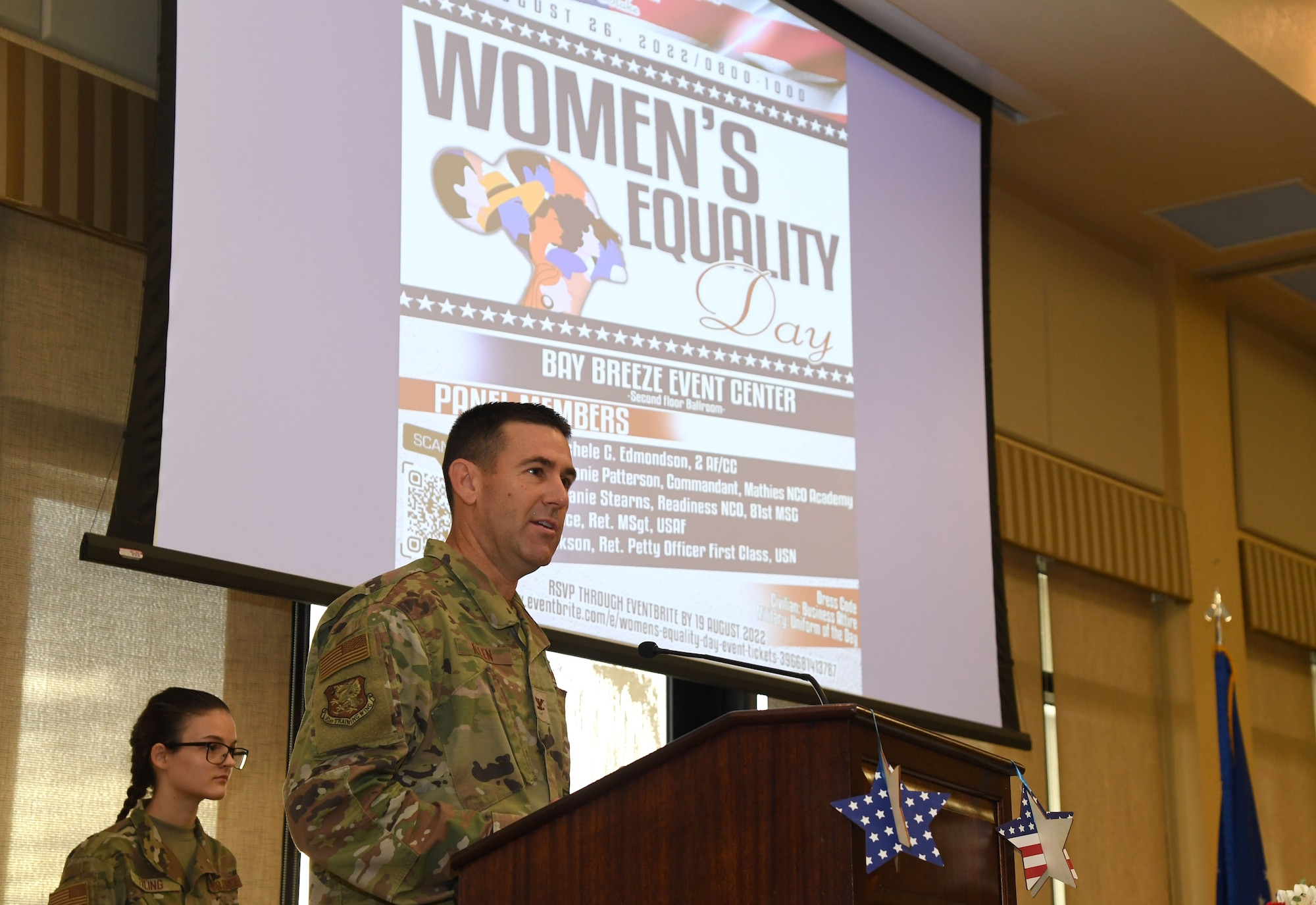 U.S. Air Force Col. Jason Allen, 81st Training Wing vice commander, delivers remarks during the Women's Equality Day event inside the Bay Breeze Event Center at Keesler Air Force Base, Mississippi, Aug. 26, 2022. On Women's Equality Day, we honor the movement for universal suffrage that led to the 19th Amendment, celebrate the progress of women over the years, and renew our commitment to advancing gender equity and protecting women's rights. (U.S. Air Force photo by Kemberly Groue)