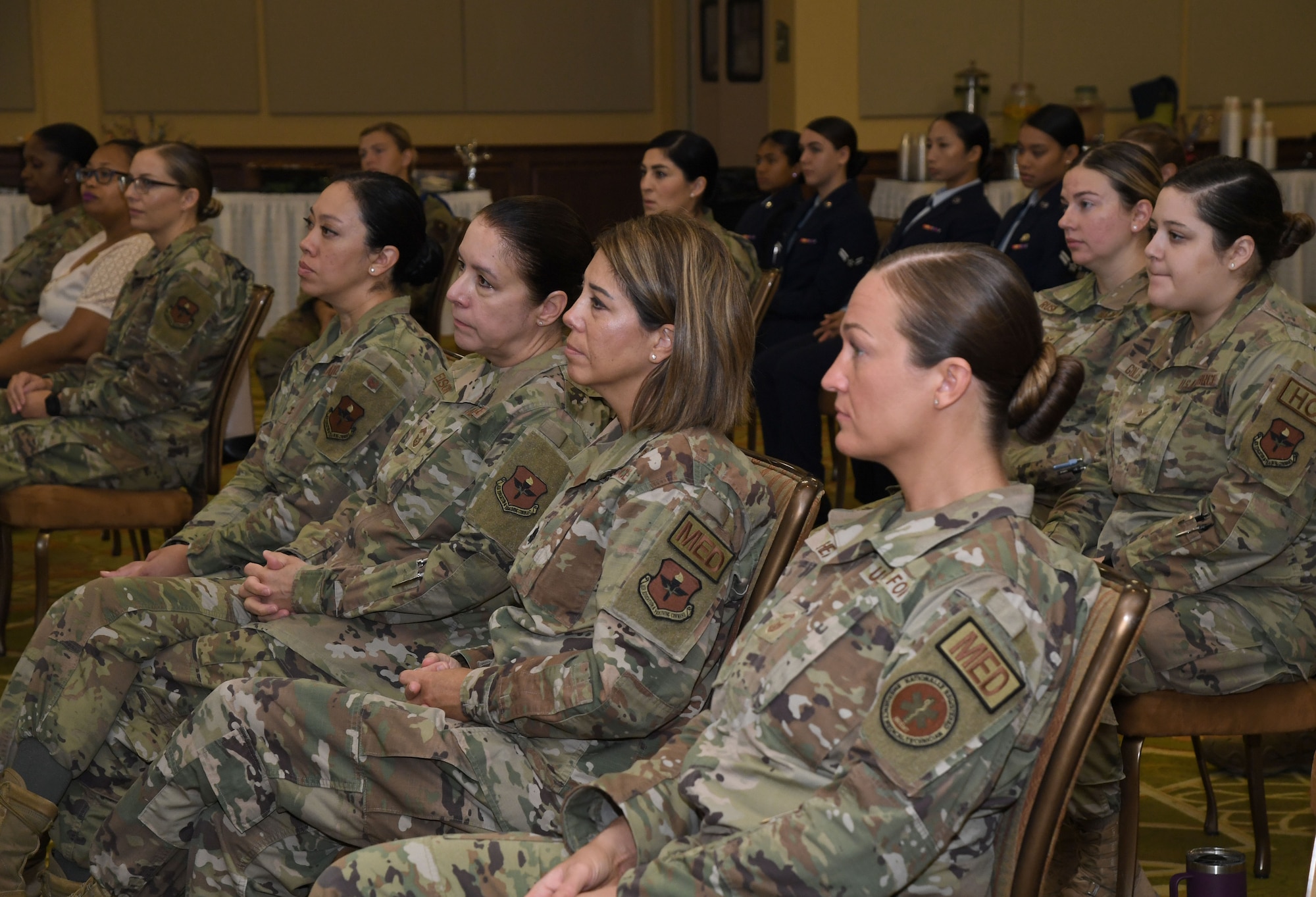 Keesler personnel attend the Women's Equality Day event inside the Bay Breeze Event Center at Keesler Air Force Base, Mississippi, Aug. 26, 2022. On Women's Equality Day, we honor the movement for universal suffrage that led to the 19th Amendment, celebrate the progress of women over the years, and renew our commitment to advancing gender equity and protecting women's rights. (U.S. Air Force photo by Kemberly Groue)