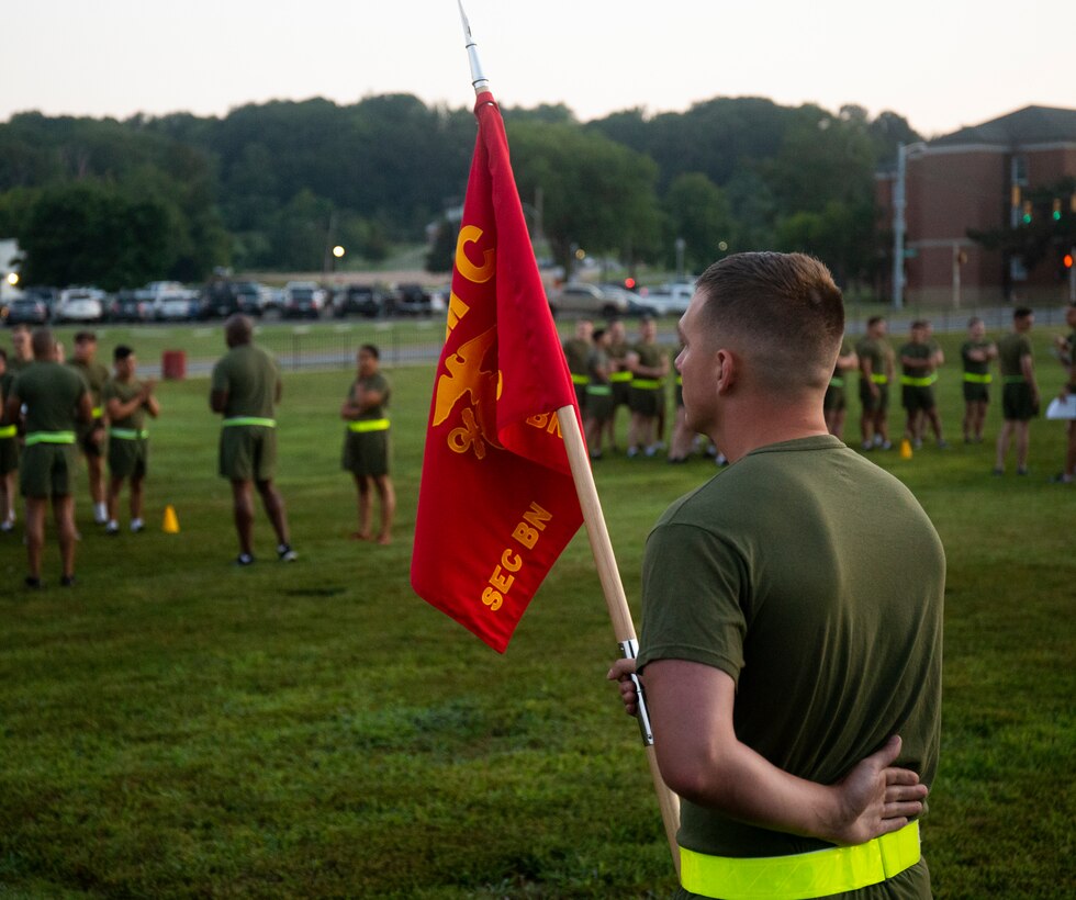 U.S. Marines assigned to Security Battalion stand in formation before a unit formation run at Marine Corps Base Quantico, Virginia, Aug. 24, 2022. The motivational run built camaraderie and unit cohesion, and promoted physical fitness among Marine. (U.S. Marine Corps photo by Cpl. Andrew Herwig)