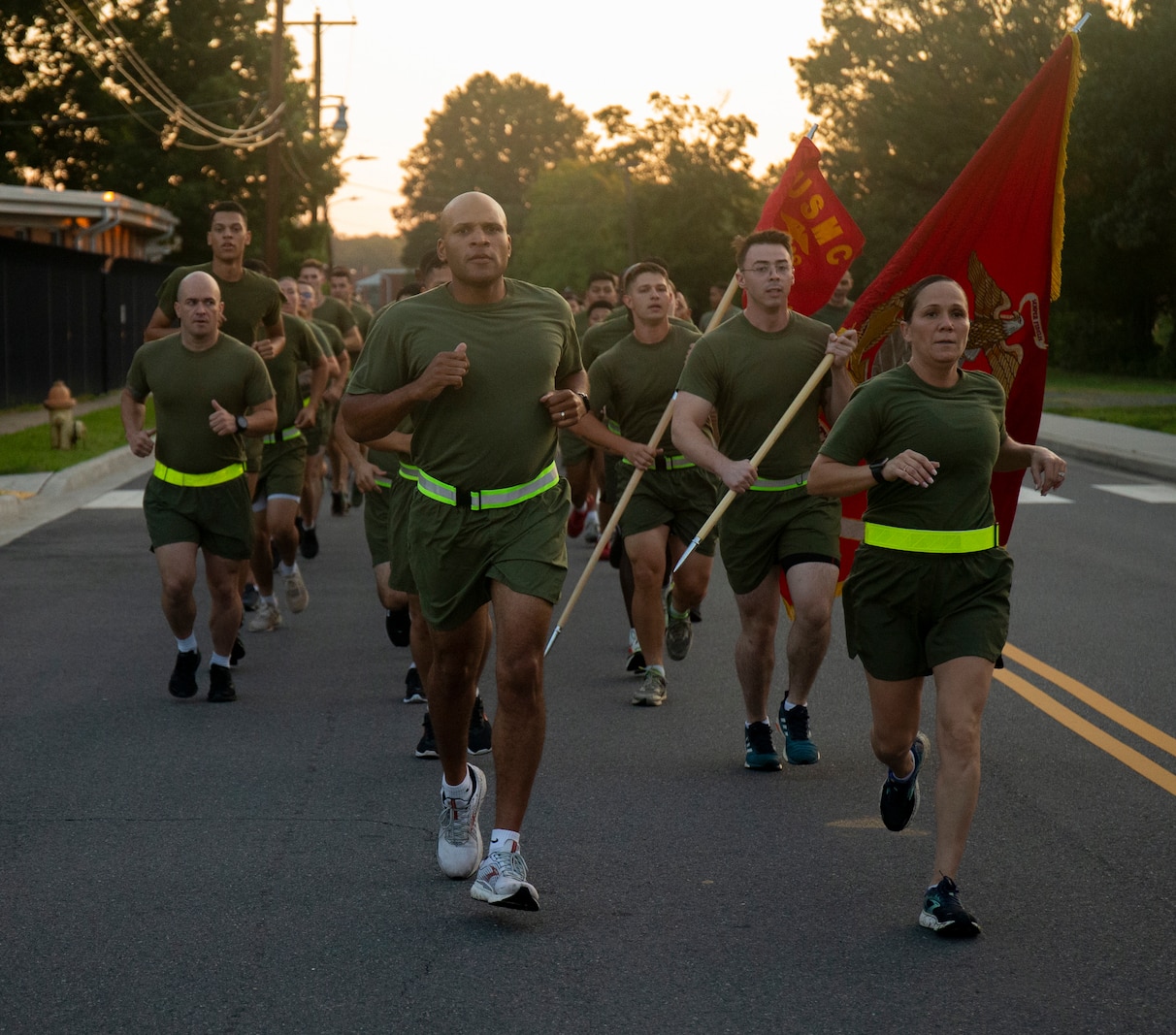 U.S. Marine Corps Lt. Col. David S. Rainey (Left), the Security Battalion Commanding Officer, and Sgt. Maj. Jacqueline Townsel (Right), the Security Battalion Sgt. Maj., lead the unit formation run at Marine Corps Base Quantico, Virginia, Aug. 24, 2022. The motivational run built camaraderie and unit cohesion, and promoted physical fitness among Marines. (U.S. Marine Corps photo by Cpl. Andrew Herwig)
