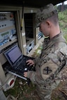 Pfc. Lawson Graham, 115 Signal Battalion, monitors signal strength while providing connectivity to field operations during exercise Northern Strike