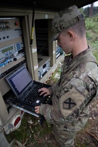 Pfc. Lawson Graham, 115 Signal Battalion, monitors signal strength while providing connectivity to field operations during exercise Northern Strike