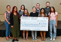Recipients of the Silver Wings Scholarship Fund showcase the check they received