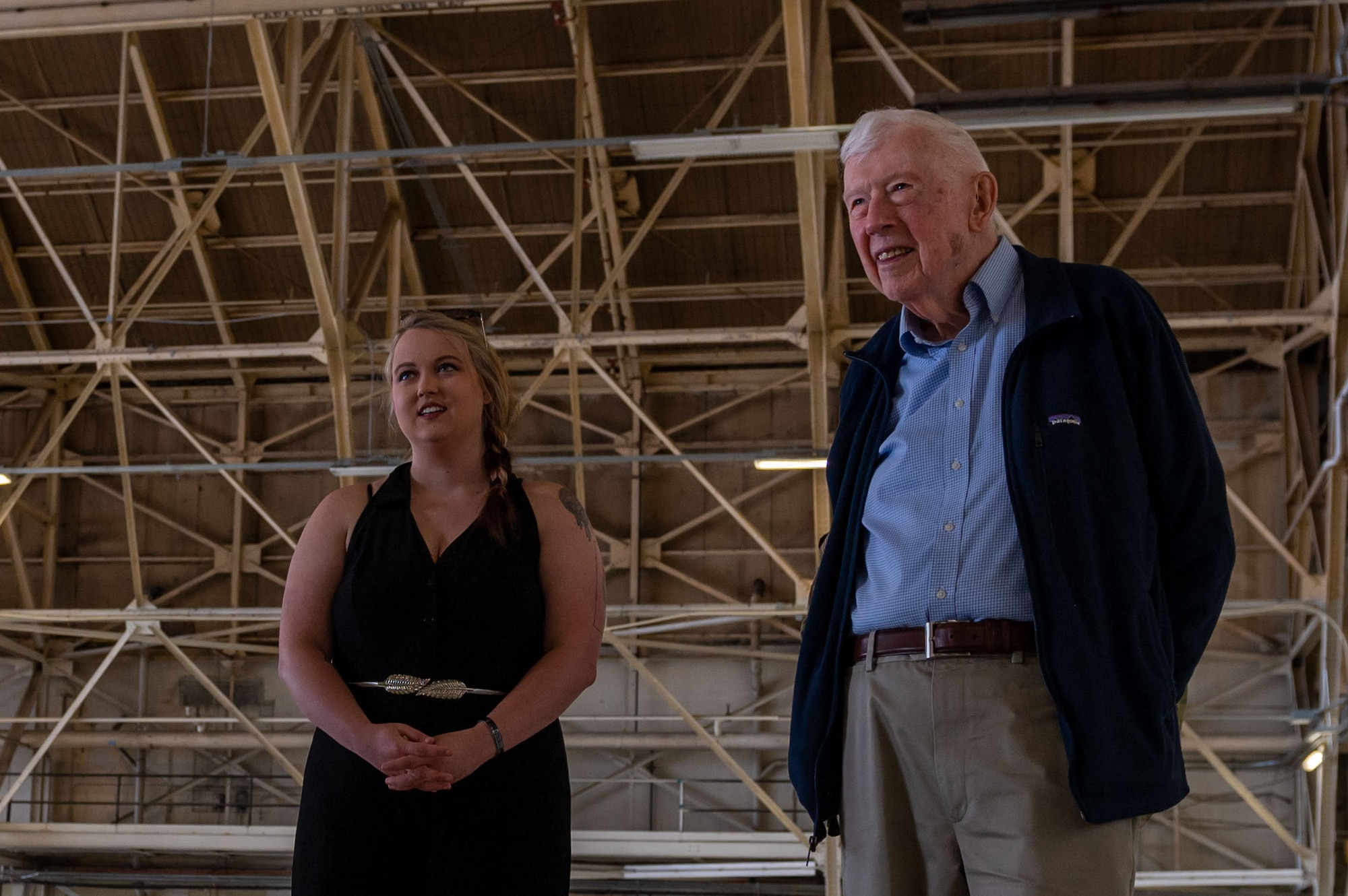 Retired Gen. John Shaud, former 92nd Bombardment wing commander, tours Fairchild's oldest aircraft hangar at Fairchild Air Force Base, Washington, August 22, 2022. The hanger has been renovated, but the original frame remains untouched. (U.S. Air Force photo by Airman 1st Class Morgan Dailey)