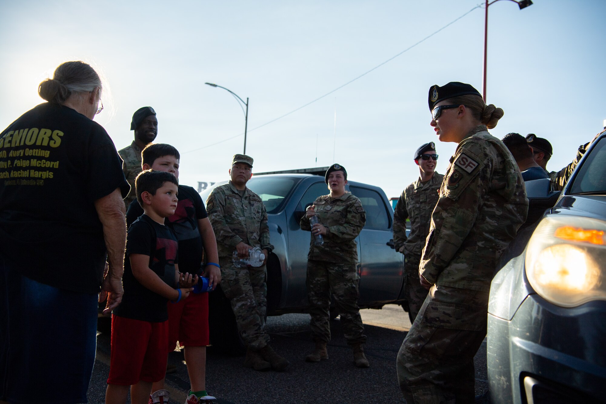 A U.S. Airman from the 27th Special Operations Wing, 27th Special Operations Security Forces Squadron, Cannon Air Force Base, showcases an MRZR all-terrain vehicle to Clovis residents during National Night Out Aug. 2, 2022, at Green Acres Park, Clovis, New Mexico. Cannon Air Commandos from the 27th SOSFS and various New Mexico law enforcement and first responders took part in the event, which is part of a nation-wide campaign to strengthen community safety and enhance relationships between residents and law enforcement. (U.S. Air Force photo by Staff Sgt. Peter Reft)