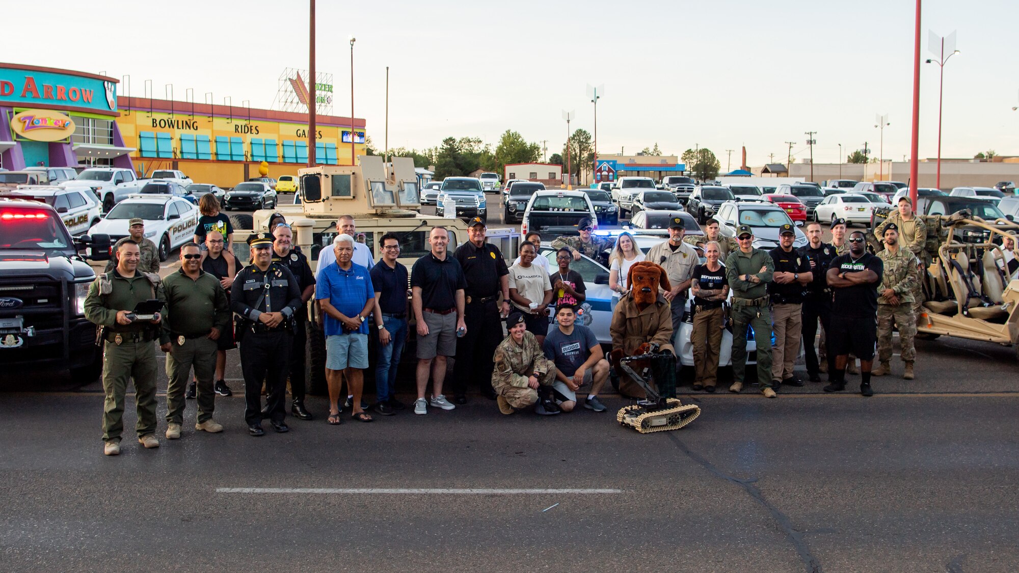 City of Clovis leaders, law enforcement organizations and U.S. Airmen from Cannon Air Force Base gather for a group photo during National Night Out Aug. 2, 2022, at Green Acres Park, Clovis, New Mexico. Cannon Air Commandos from the 27th SOSFS and various New Mexico law enforcement and first responders took part in the event, which is part of a nation-wide campaign to strengthen community safety and enhance relationships between residents and law enforcement. (U.S. Air Force photo by Staff Sgt. Peter Reft)
