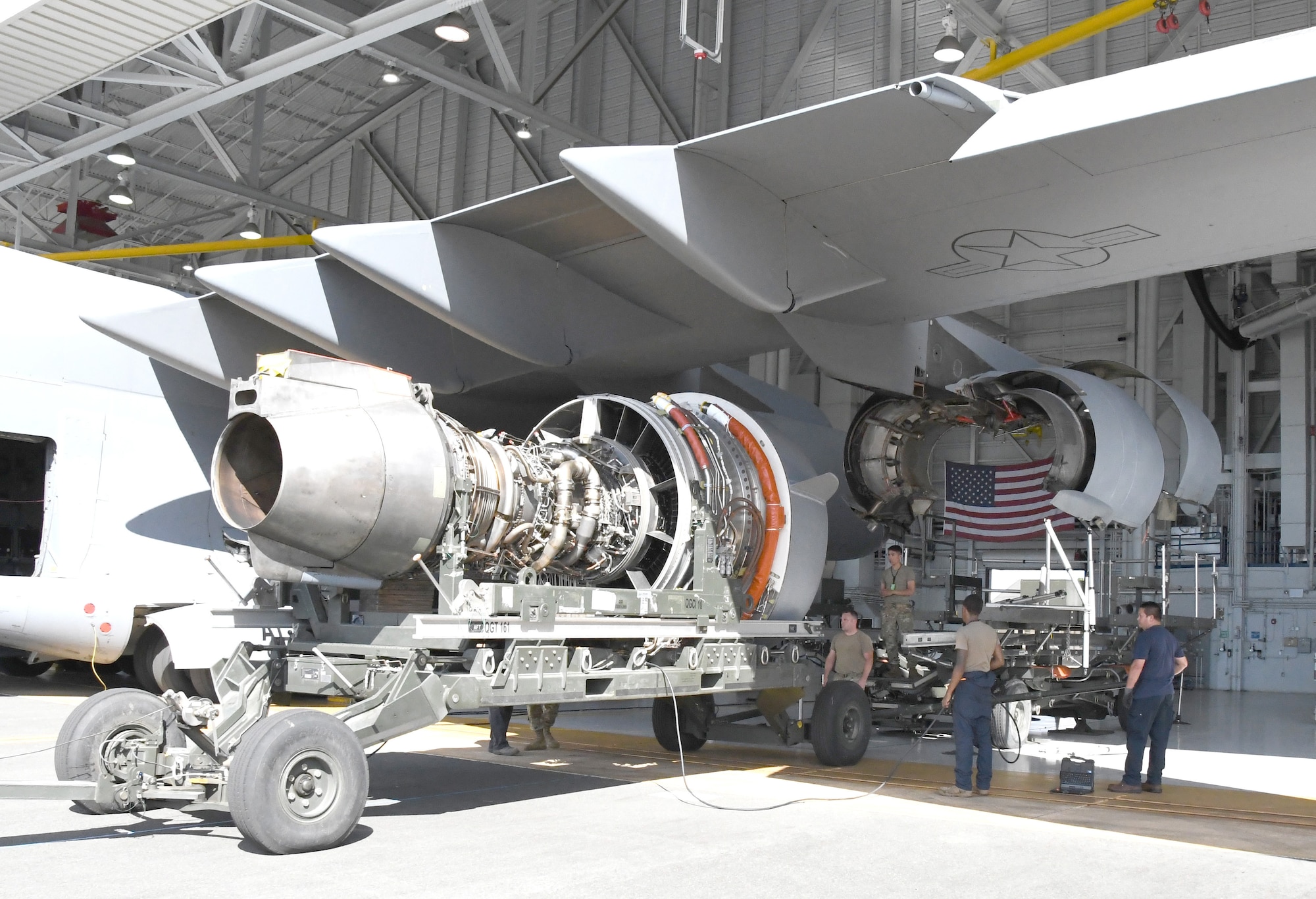U.S. Air Force Airmen assigned to the 735th Air Mobility Squadron and the 15th Maintenance Group prepare a C-17 Globemaster III engine for installation at Joint Base Pearl Harbor-Hickam, Hawaii on Aug. 19, 2022. (U.S. Air Force photo by Amelia Dickson)