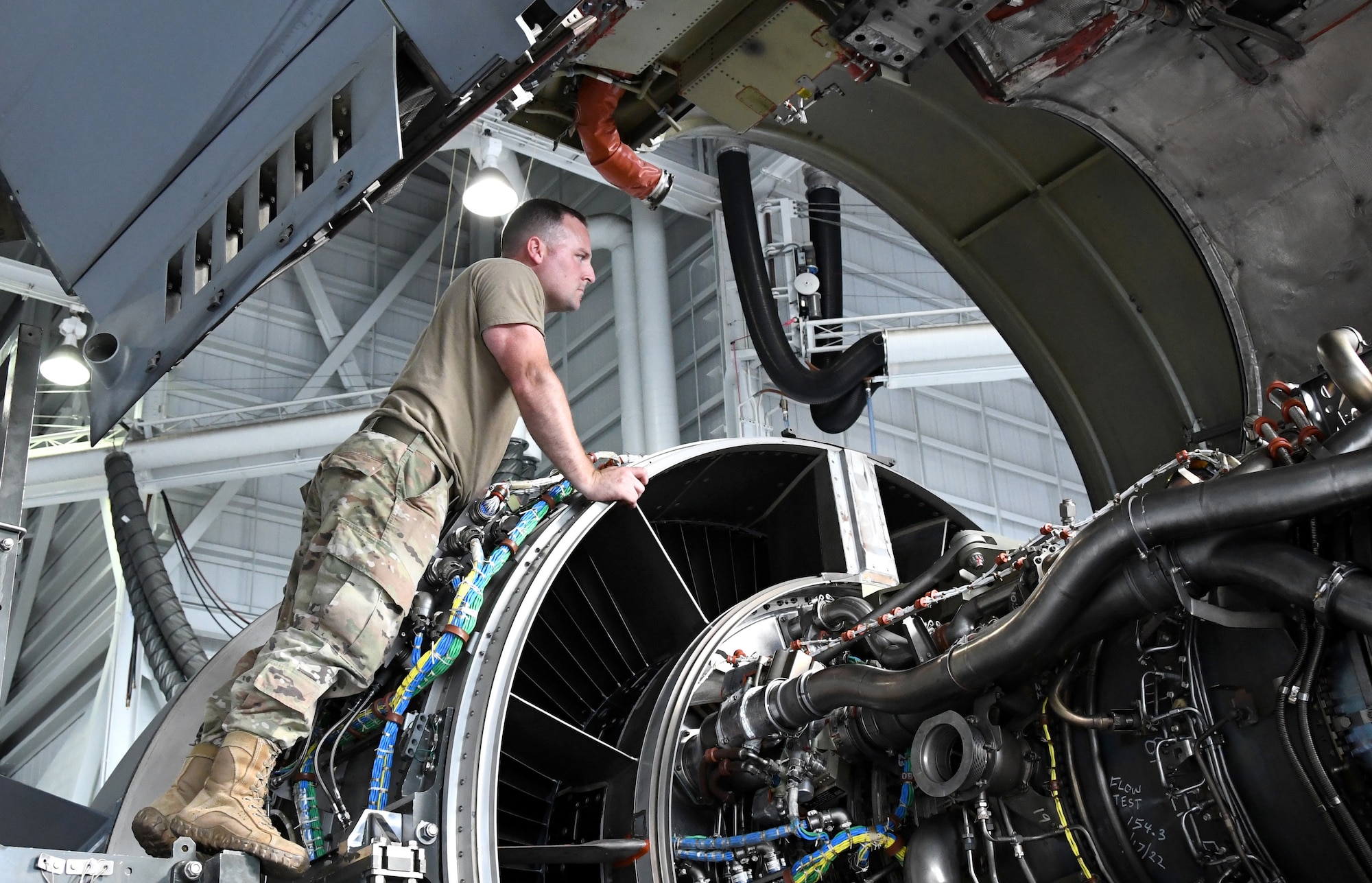 U.S. Air Force Tech. Sgt. Derek Lescord, assigned to the 735th Air Mobility Squadron, inspects a C-17 Globemaster III engine before installation at Joint Base Pearl Harbor-Hickam, Hawaii on Aug. 19, 2022. (U.S. Air Force photo by Amelia Dickson)