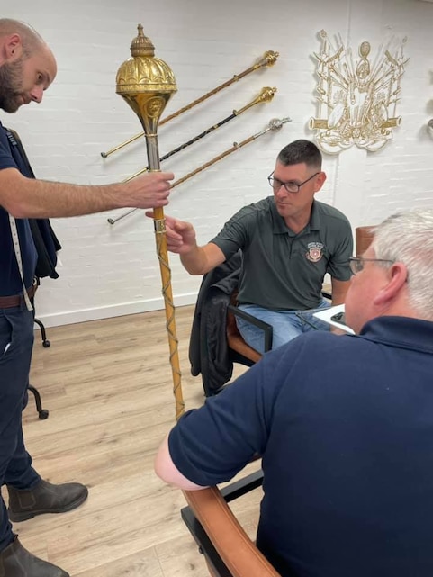 Drum Major King compares malacca canes to use for the new mace. Photo taken during Drum Major Master Gunnery Sgt. King's September 2021 visit to mace manufacturing company Dalman & Narborough, based in Birmingham, England. Courtesy of Dalman & Narborough.