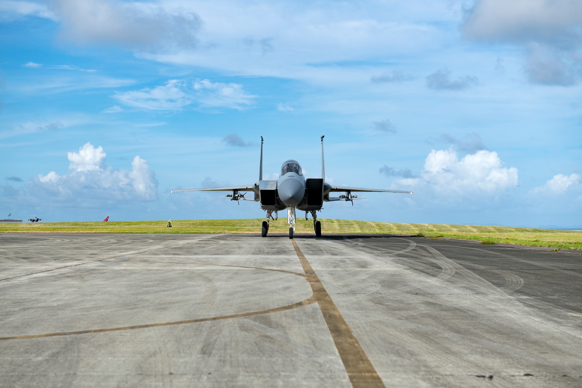An F-15C Eagle assigned to the 44th Fighter Squadron waits on the service apron to receive hot-pit refueling between sorites in support of surge operations at Kadena Air Base, Japan, Aug. 24, 2022. Surge operations provide aircrew and support personnel the opportunity to train the skills necessary to maintain a ready force, capable of ensuring the collective defense of the Indo-Pacific region. (U.S. Air Force photo by Senior Airman Jessi Roth)