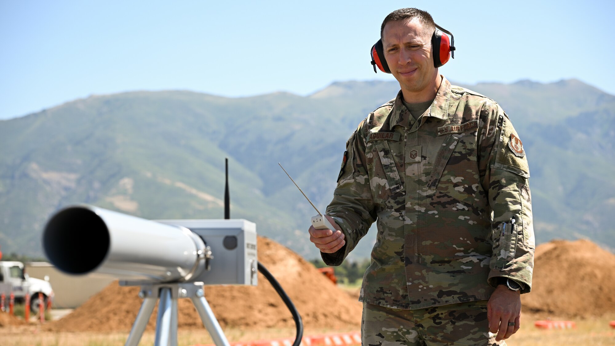 Master Sgt. Chris Aguilar, 75th Air Base Wing Safety Office superintendent, fires a propane cannon.