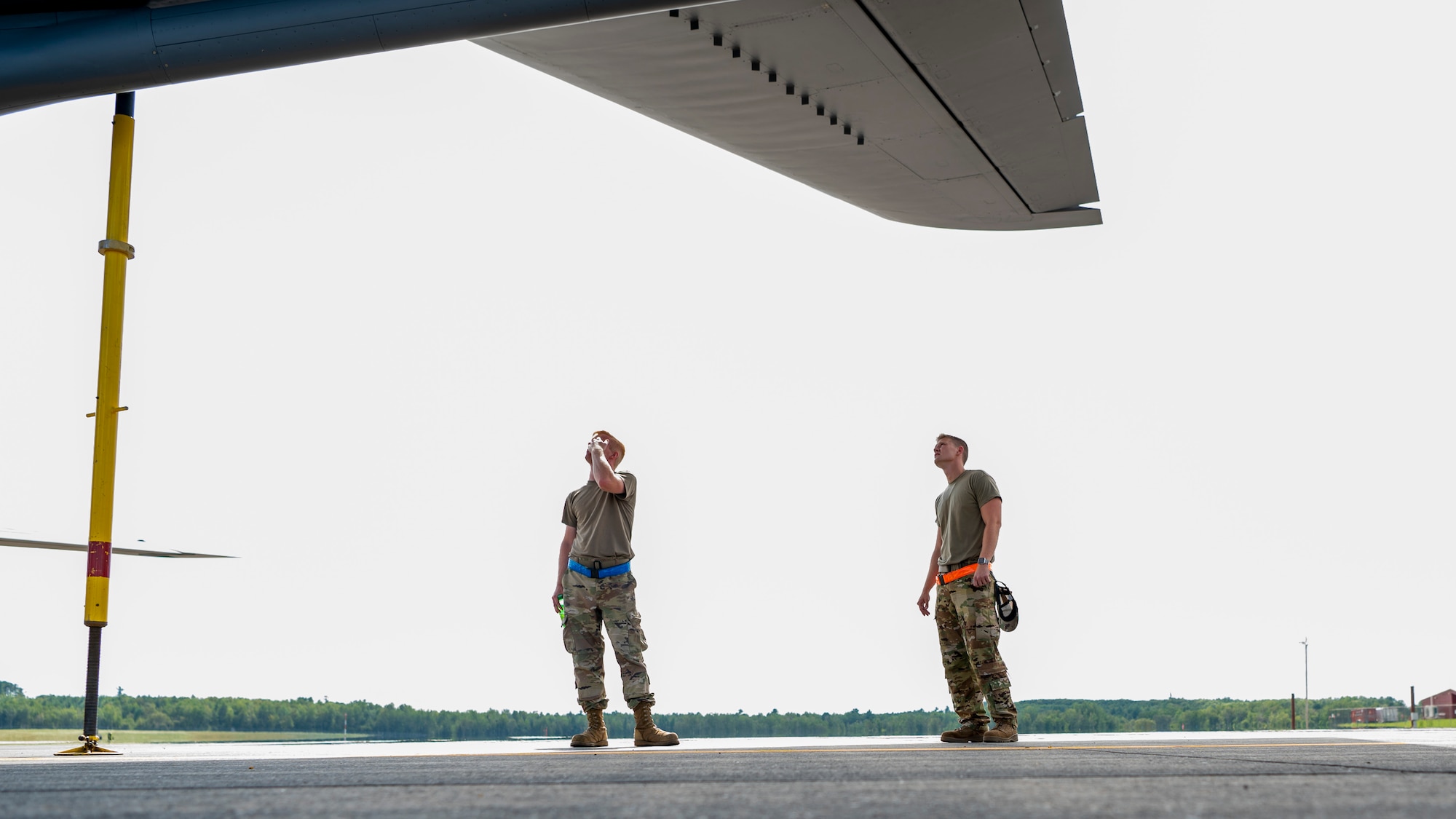 U.S. Air Force Senior Airman Jacob Tobolski (left) and Staff Sgt. Nicholas Zeagler, maintainers assigned to the 6th Aircraft Maintenance Squadron, inspect a KC-135 Stratotanker assigned to the 91st Air Refueling Squadron at Bangor Air National Guard Base, Maine, Aug. 25, 2022.