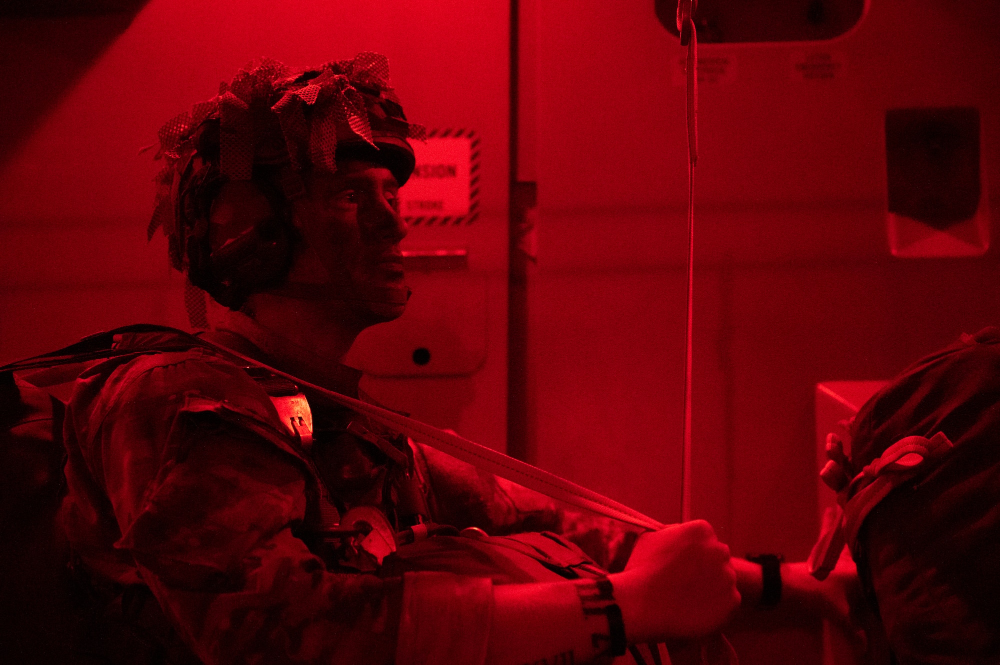 Army ranger prepares to jump out of a C-17 Globemaster III.