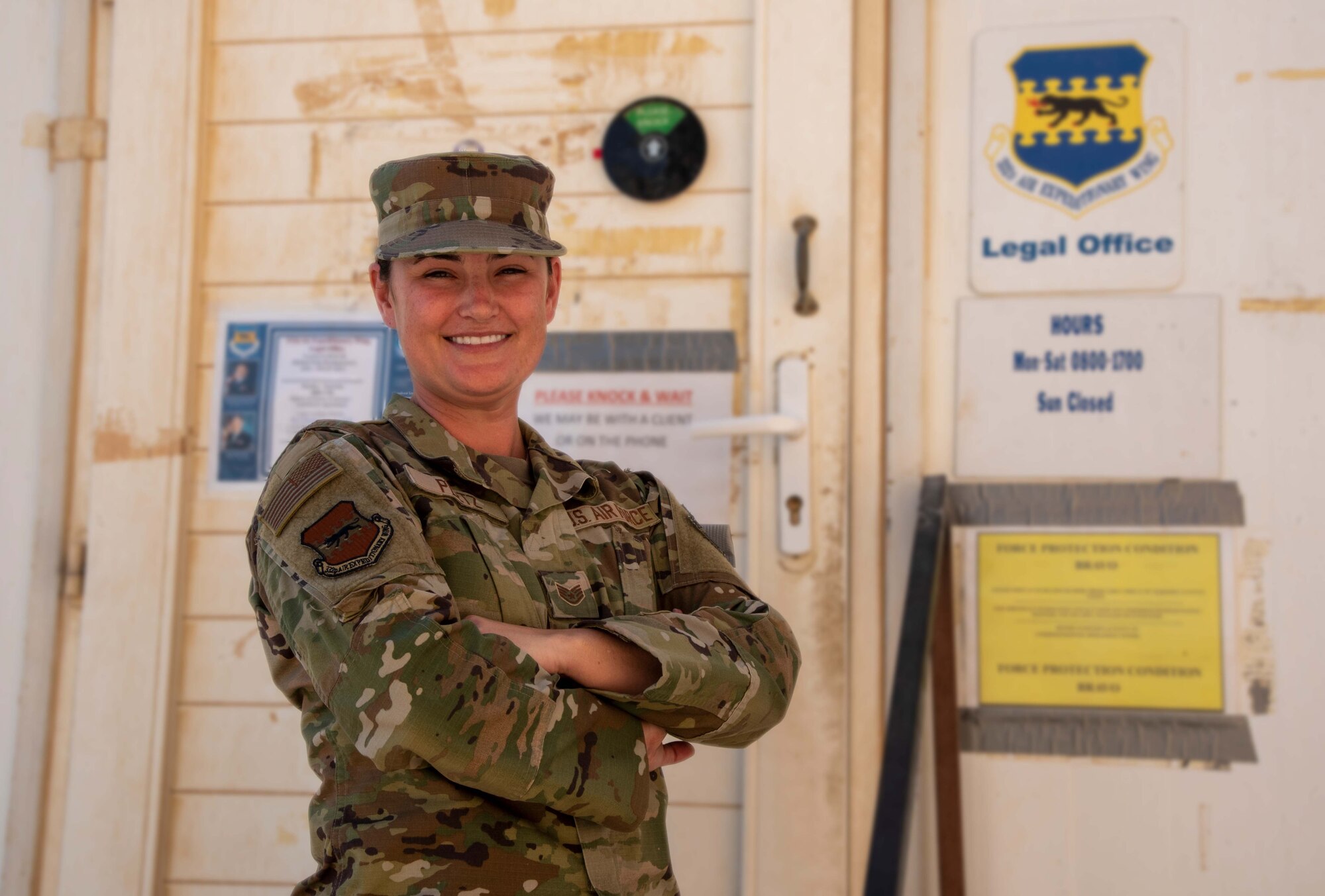 Staff Sgt. Kelly Pletz receives the "Warrior of the Week" award at the Judge Advocate General Office, 332d Aerial Expeditionary Wing at an undisclosed location in Southwest Asia, August 26, 2022. Pletz earned recognition for her many contributions to the mission in addition to her work as the Non-Commissioned Officer In Charge of the Legal Office. (U.S. Air Force photo by: Tech. Sgt. Jim Bentley)