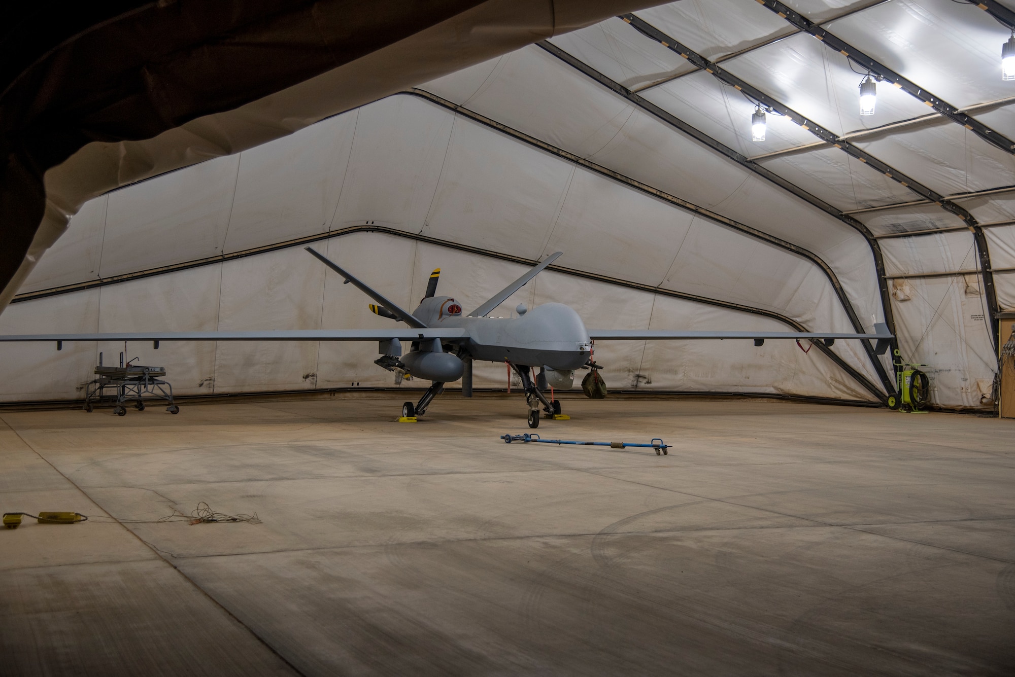 Long exposure photo of an MQ-9 Reaper on the 361 Expeditionary Attack Squadron flight line at an undisclosed location, August 6, 2022. The MQ-9 is an unmanned aircraft capable of remote controlled or autonomous flight. The 361 EAS operates them in support of Operation Inherent Resolve. (U.S. Air Force photo by: Tech. Sgt. Jim Bentley)