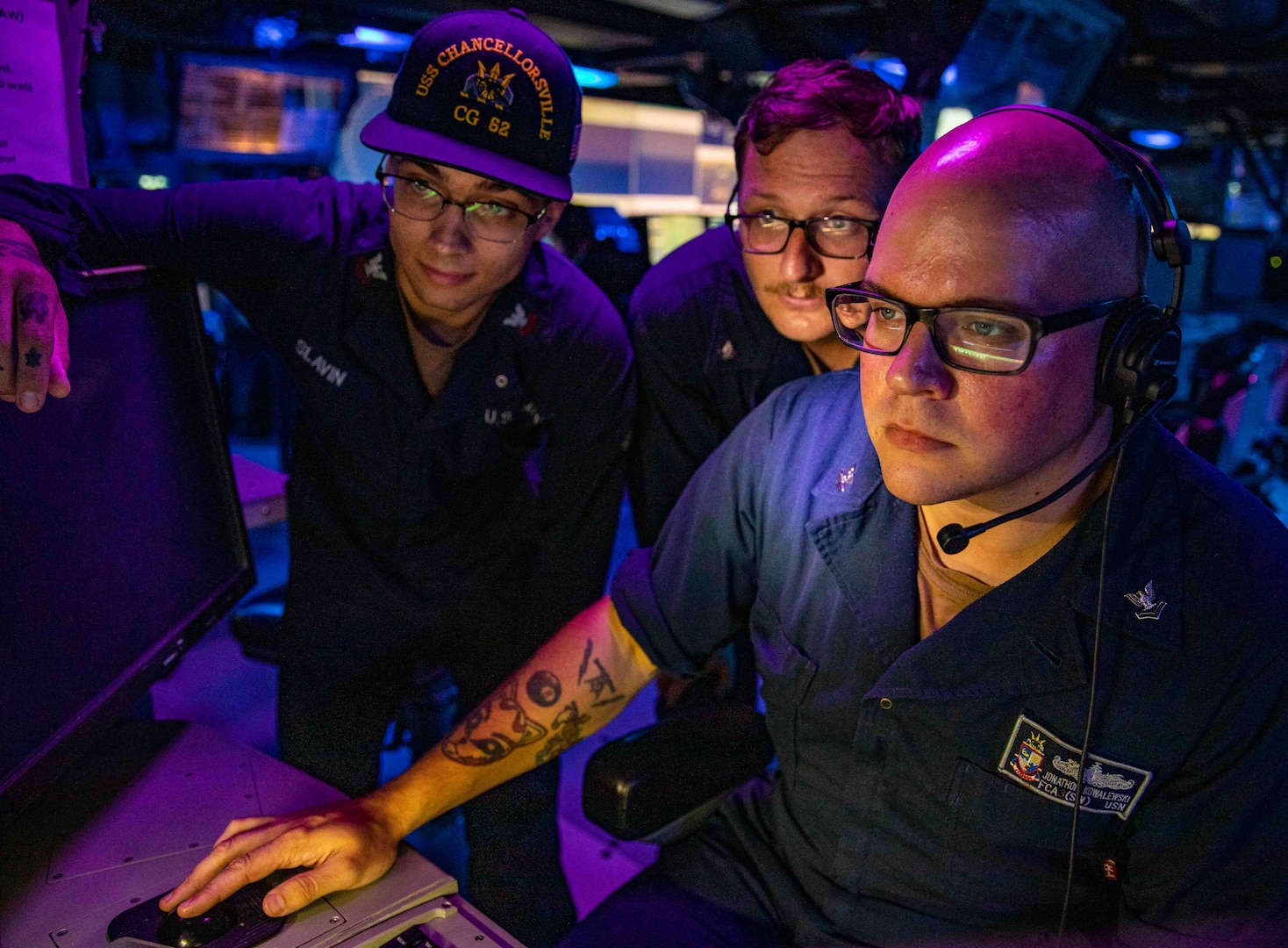 TAIWAN STRAIT (Aug. 28, 2022) Sailors stand watch in the combat information center aboard Ticonderoga-class guided-missile cruiser USS Chancellorsville (CG 62) during routine underway operations. Chancellorsville is forward-deployed to the U.S. 7th Fleet area of operations in support of a free and open Indo-Pacific. (U.S. Navy photo by Mass Communications Specialist 2nd Class Justin Stack)