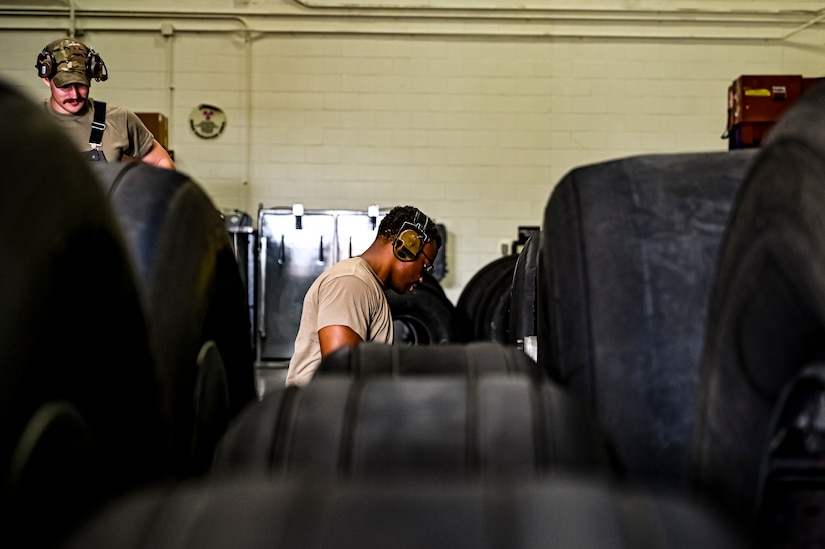 U.S. Air Force Senior Airman Rodney Alston III, 305th Maintenance Squadron crew chief, performs wheel maintenance at Joint Base McGuire-Dix-Lakehurst, N.J. on Aug. 26, 2022. Crew Chiefs in the Wheel and Tire Section of 305 MXS are validating their local ability to breakdown and build-up tire assemblies for the KC-46's main landing gear and nose landing gear. At the beginning of August 2022, the Air Force Life Cycle Management Center authorized Main Operating Bases to stand up organic tire change capability. A four member team consisting of Crew Chiefs, Sheet Metal, and Nondestructive Inspection went to Altus Air Force Base for initial training and familiarization. By validating local ability to breakdown and build-up tire assemblies for the KC-46, the 305th MXS brings a new capability to JB MDL and will be able to improve support for the KC-46 throughout the Air Force. (U.S. Air Force photo by Senior Airman Matt Porter)